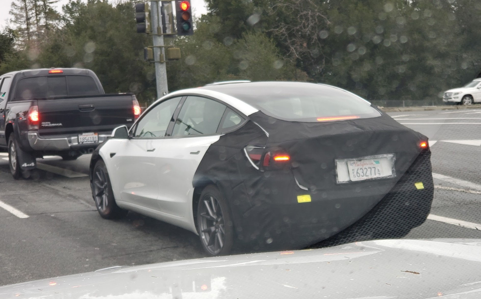 Wallpaper #qmd-DJMBSpphPi3-ad6B287 Tesla Model 3 Highland Spotted with Covered Rear and Front