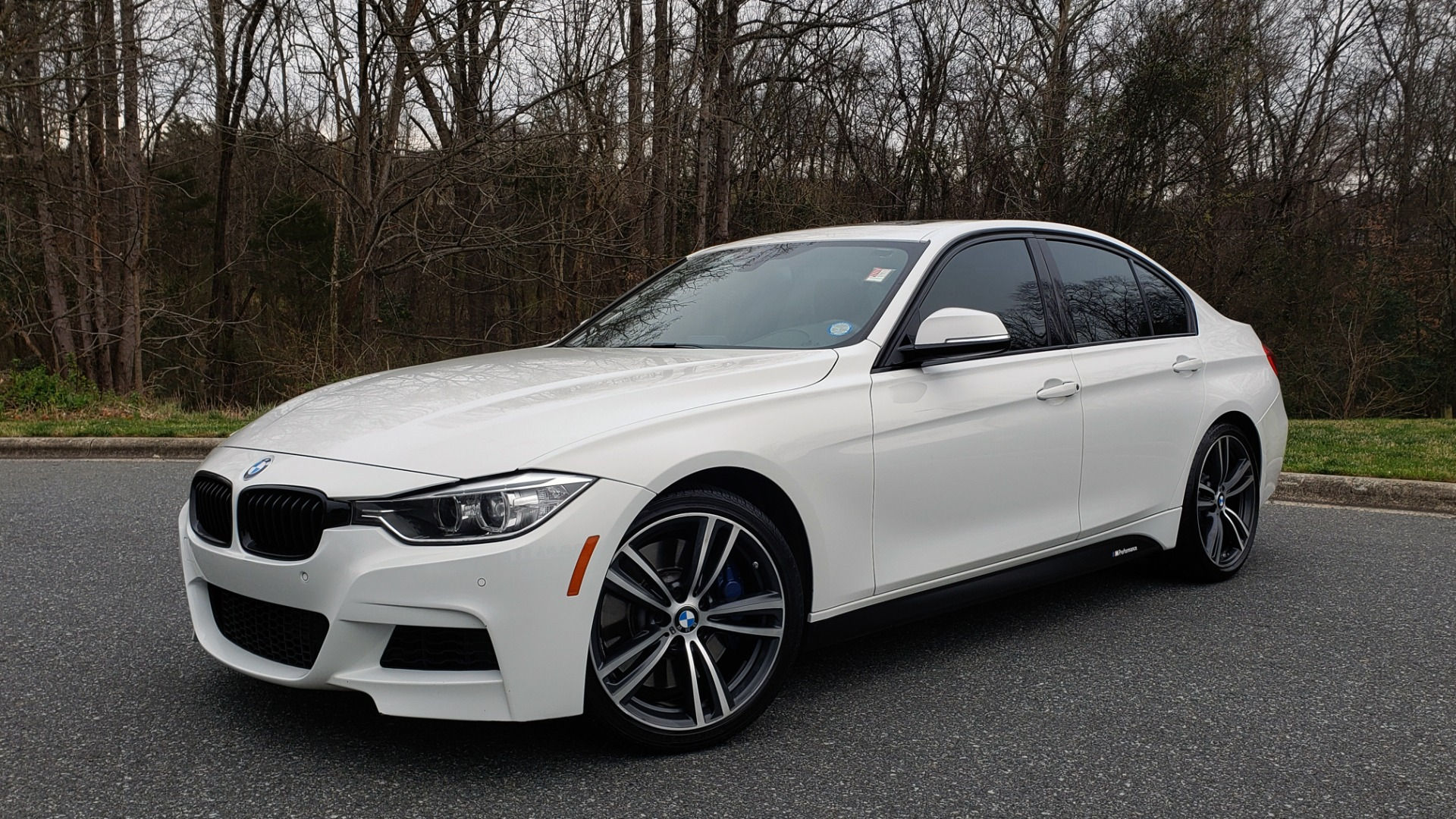 Wallpaper #9nMEgo4BFI5NbQksvxj_17 A Sleek White BMW 340i Parked on a Paved Road in Front of Some Trees