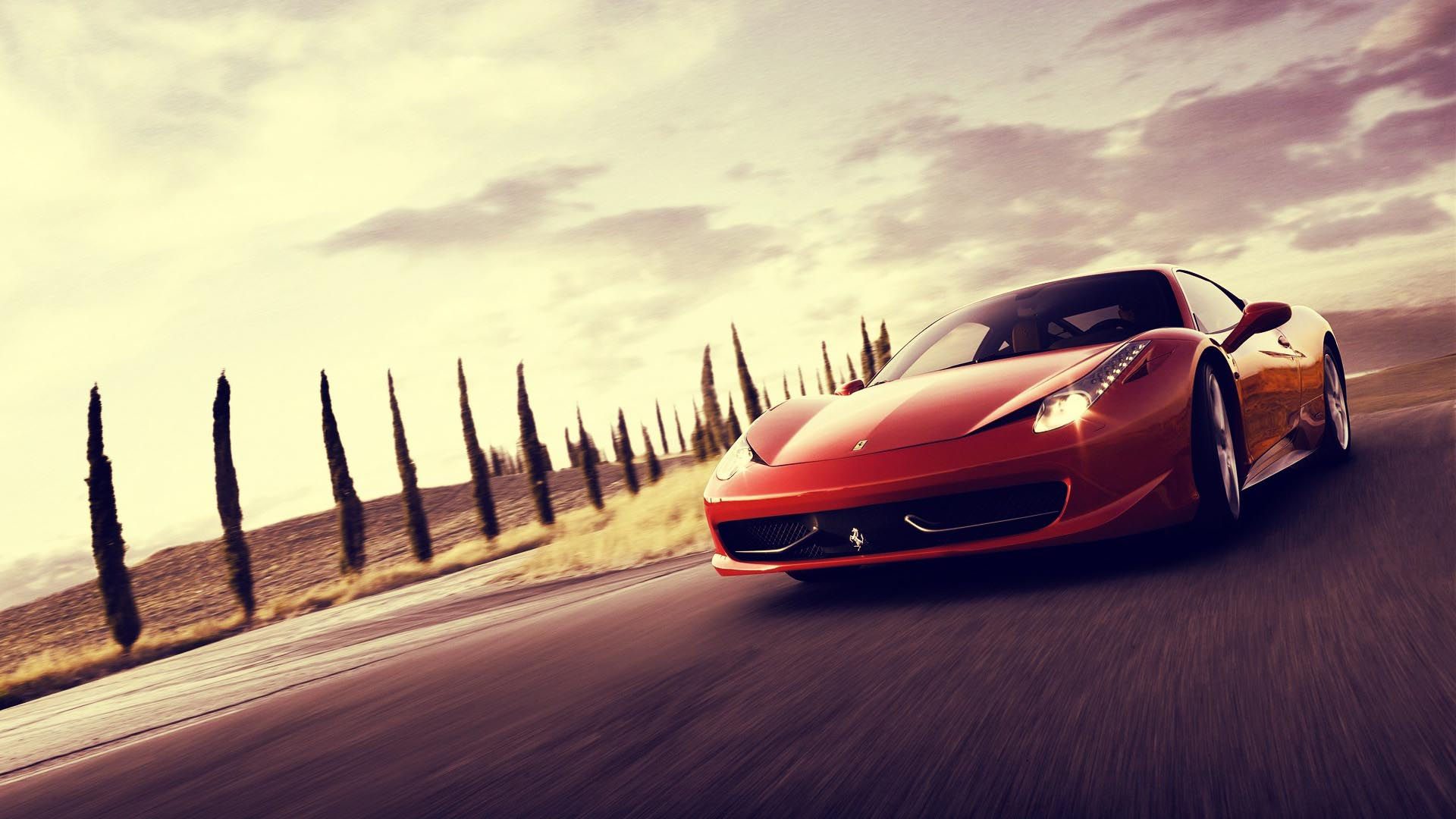 Wallpaper #6HOoiI4BFI5NbQksoSFu41 A Red Ferrari 458 Italia Sports Car Speeds Along a Tree-Lined Road