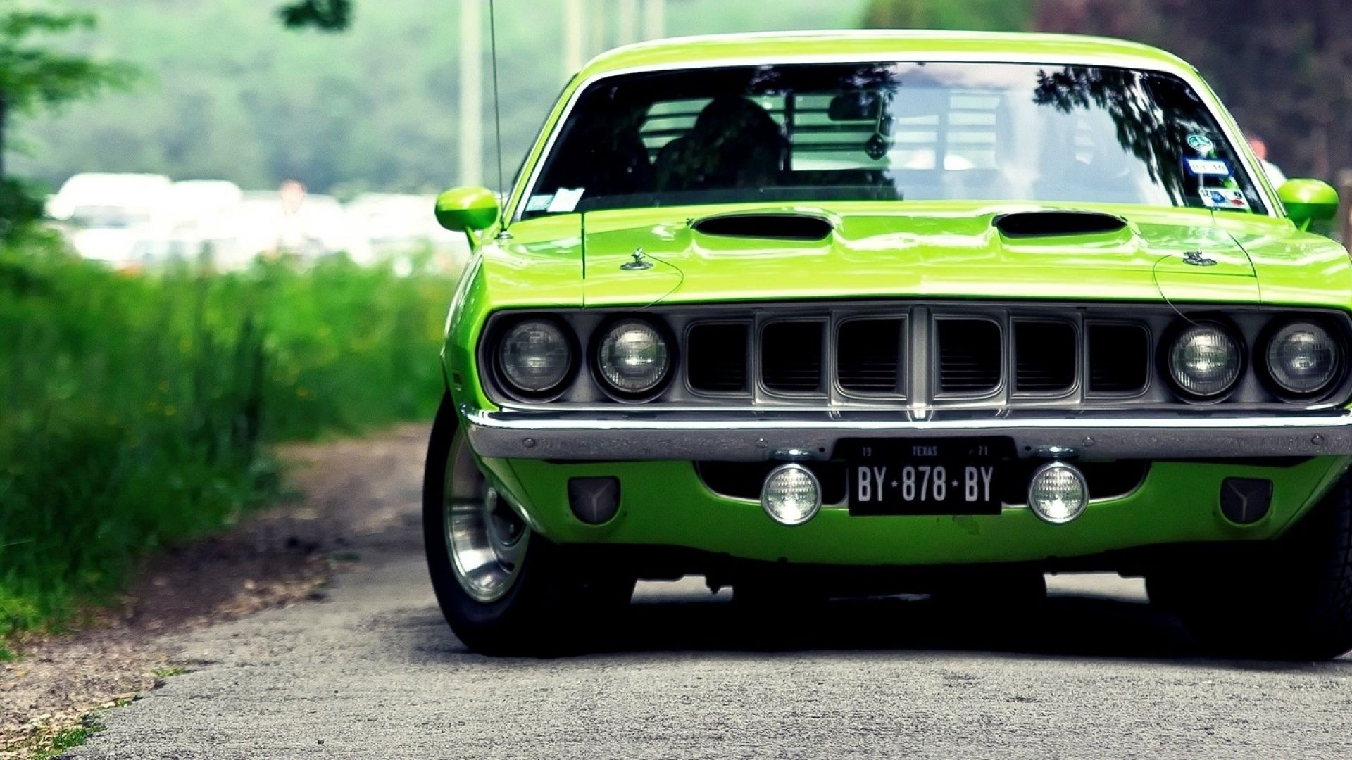 Wallpaper #lnOZg44BFI5NbQks9htG16 A Green Classic Muscle Car on an Asphalt Road