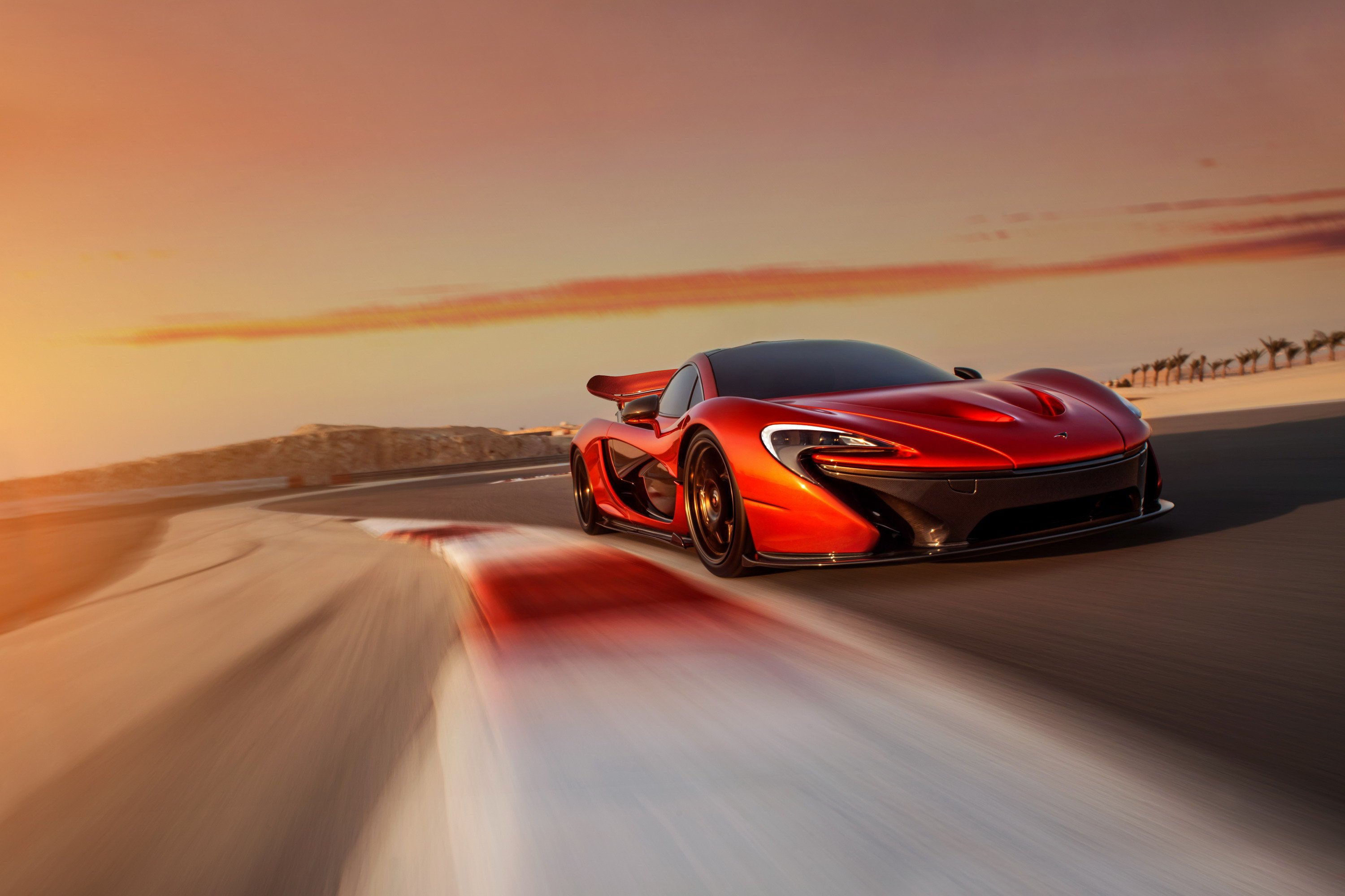 Wallpaper #hXOWg44BFI5NbQks1Buy10 A Sleek Red Sports Car Speeds Down a Winding Coastal Road