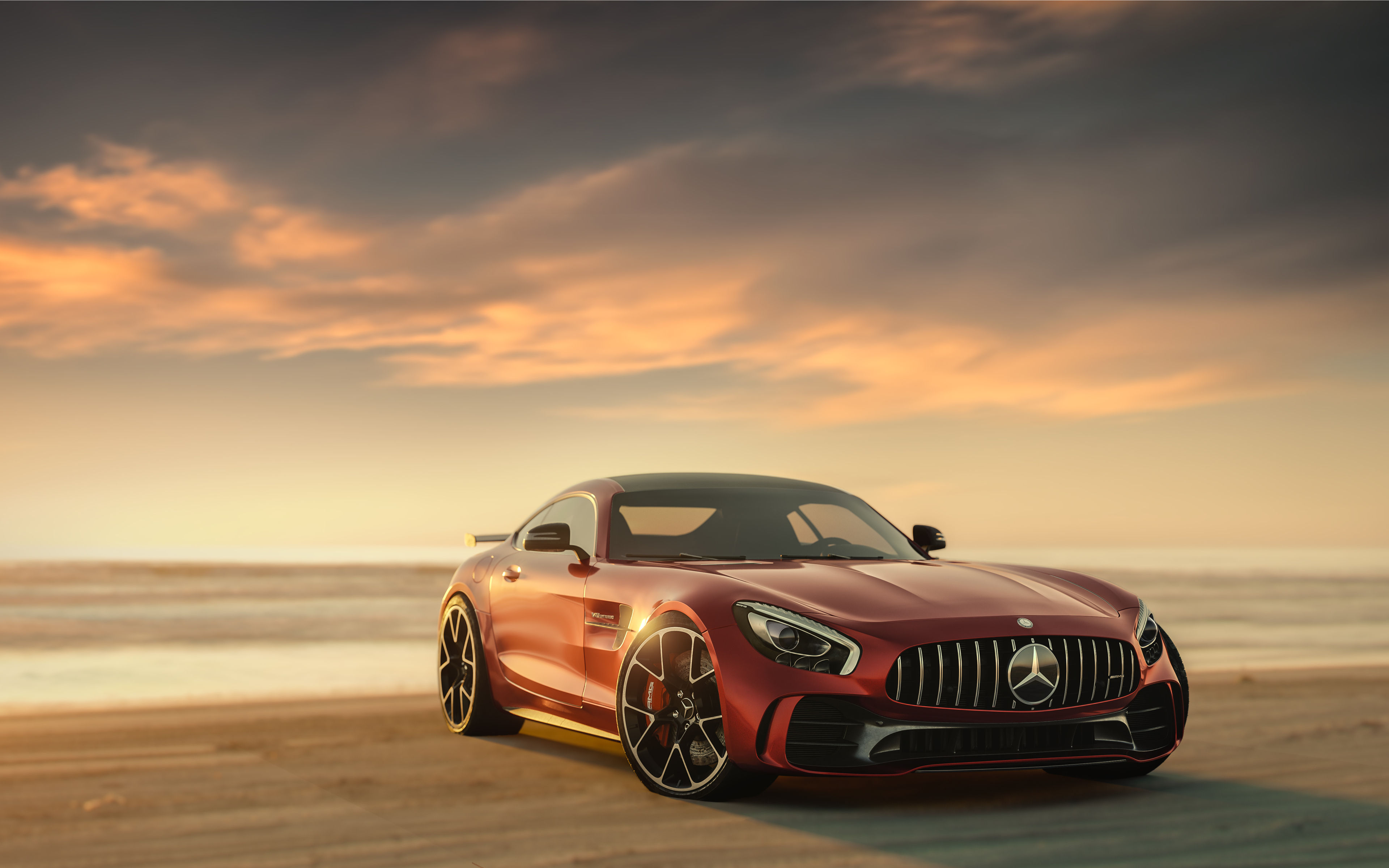 Wallpaper #z0VQl44B7YBJg1BV1qDS42 A Red Mercedes-Benz Amg GT Sports Car Parked on the Beach at Sunset