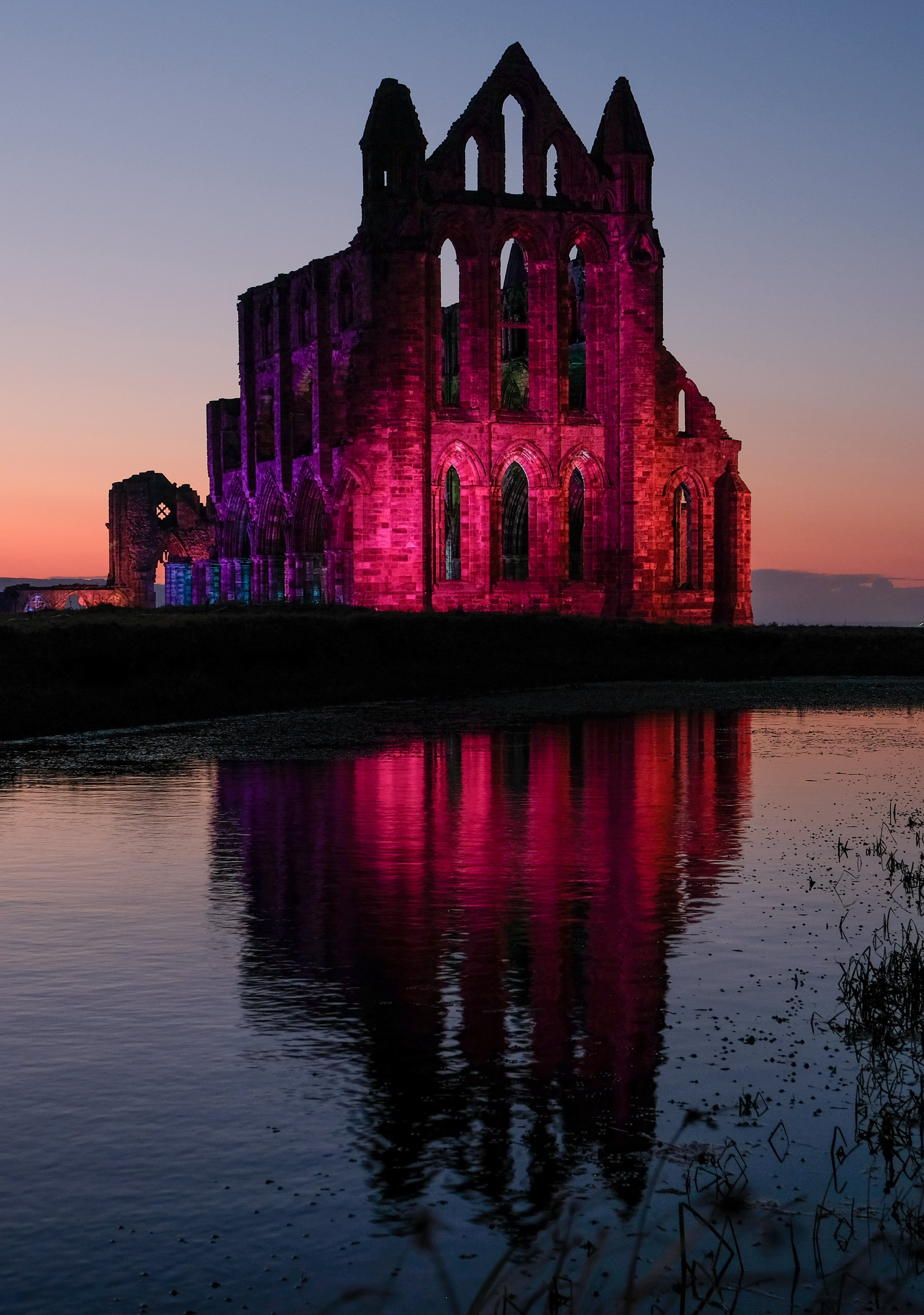 Wallpaper #UEBvMJMBJhL2WPbav8H-504 Whitby Abbey Illuminated in Halloween Homage to Dracula Author Bram Stoker