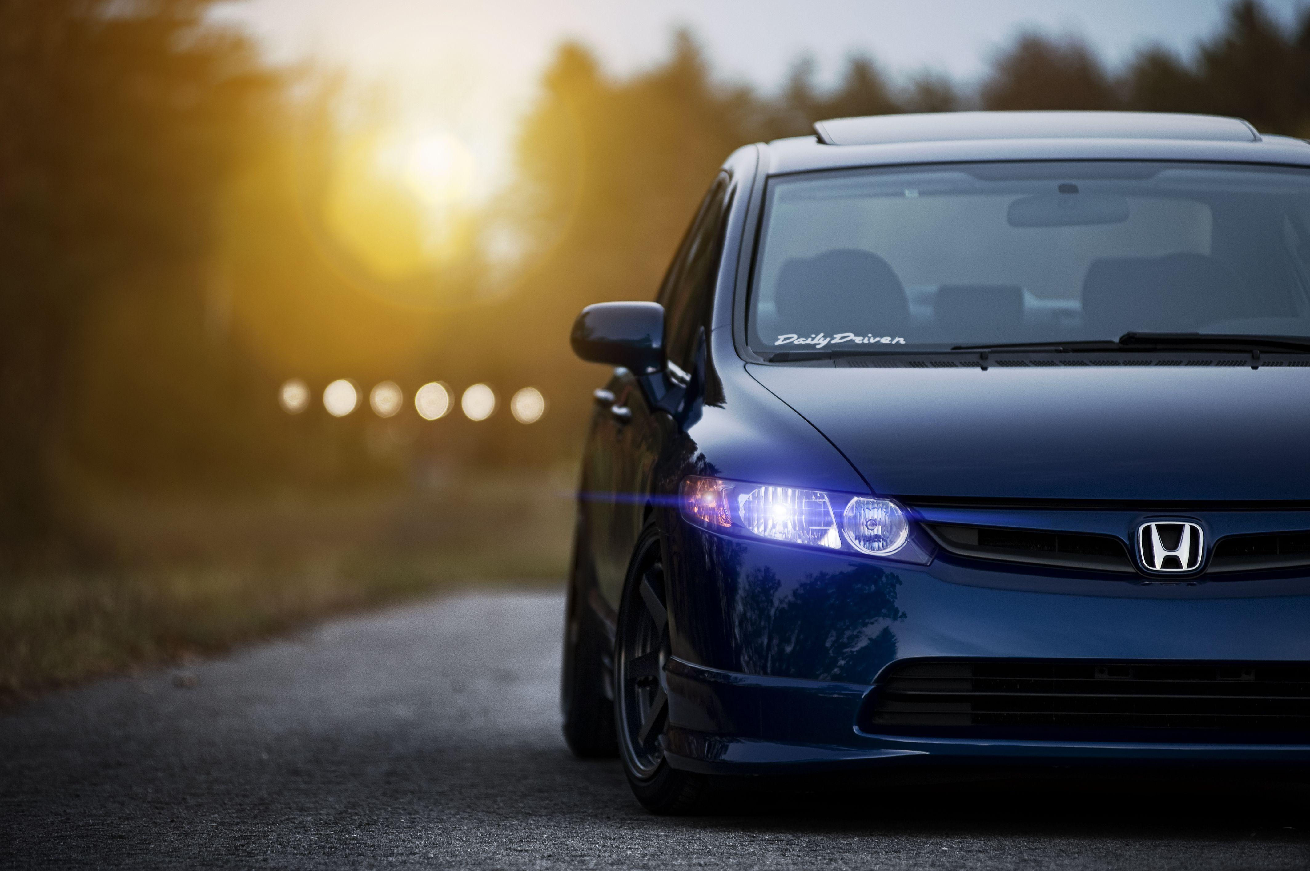 Wallpaper #r0U0l44B7YBJg1BVZKDq24 A Blue Civic Si with Aftermarket Headlights Parked on an Asphalt Road