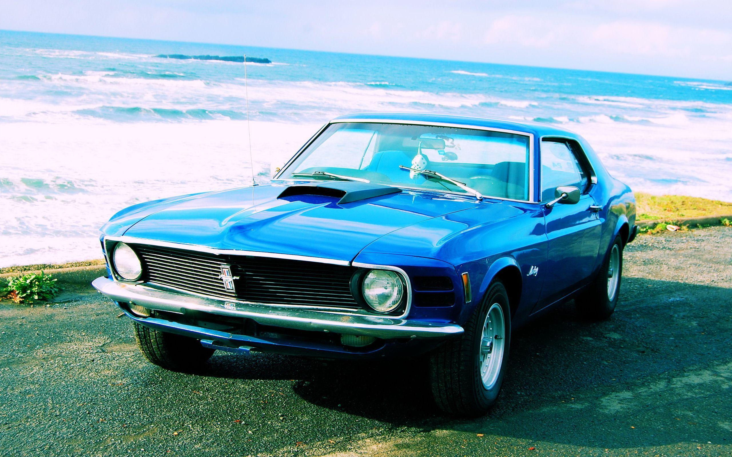 Wallpaper #_3MOho4BFI5NbQksfx5p10 A Blue 1970 Boss 302 Mustang Parked on the Beach