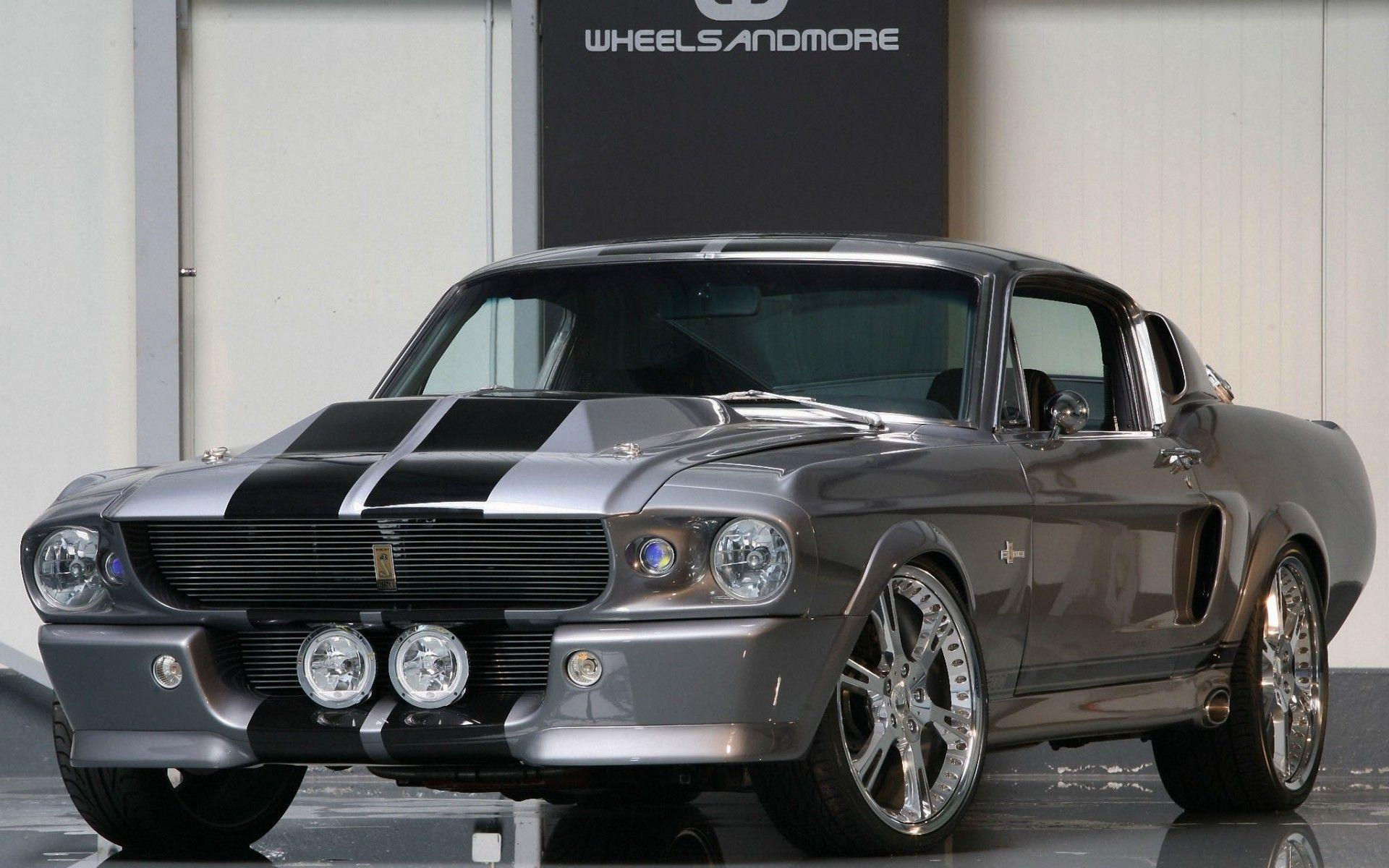 Wallpaper #_3MOho4BFI5NbQksfx5p13 A Gray Ford Mustang Shelby Gt500 with Black Stripes on the Hood