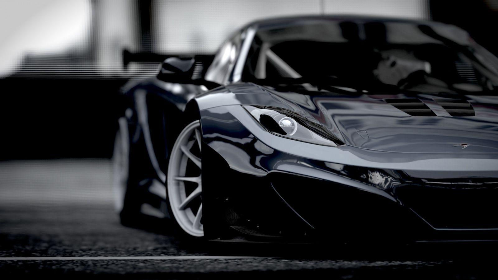 Wallpaper #7nPJiI4BFI5NbQksYiGU2 A Black and White Close-Up of a Mclaren Sports Car