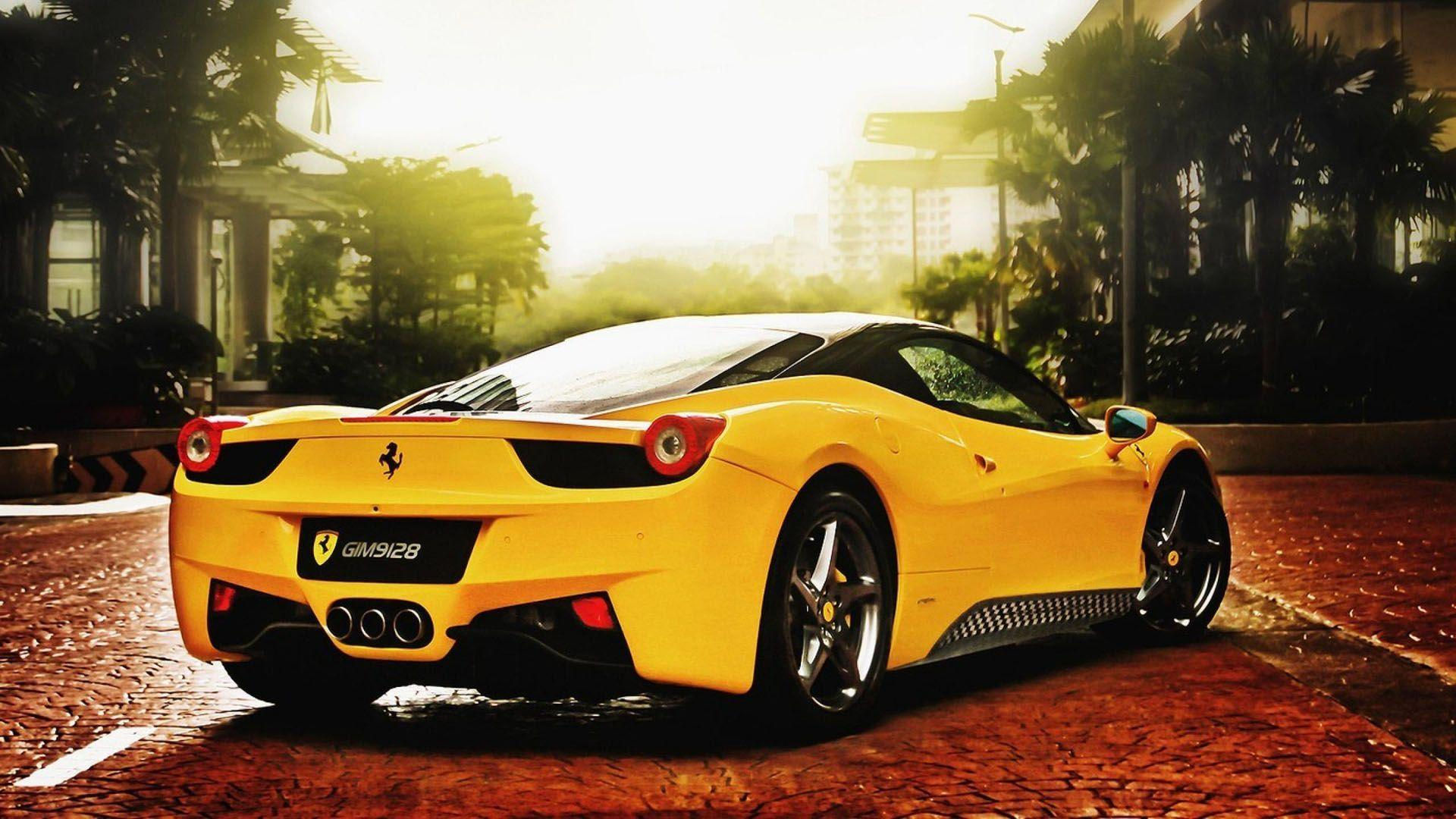 Wallpaper #A0V9jo4B7YBJg1BVFJ3F39 A Bright Yellow Ferrari Drives Through the City Streets