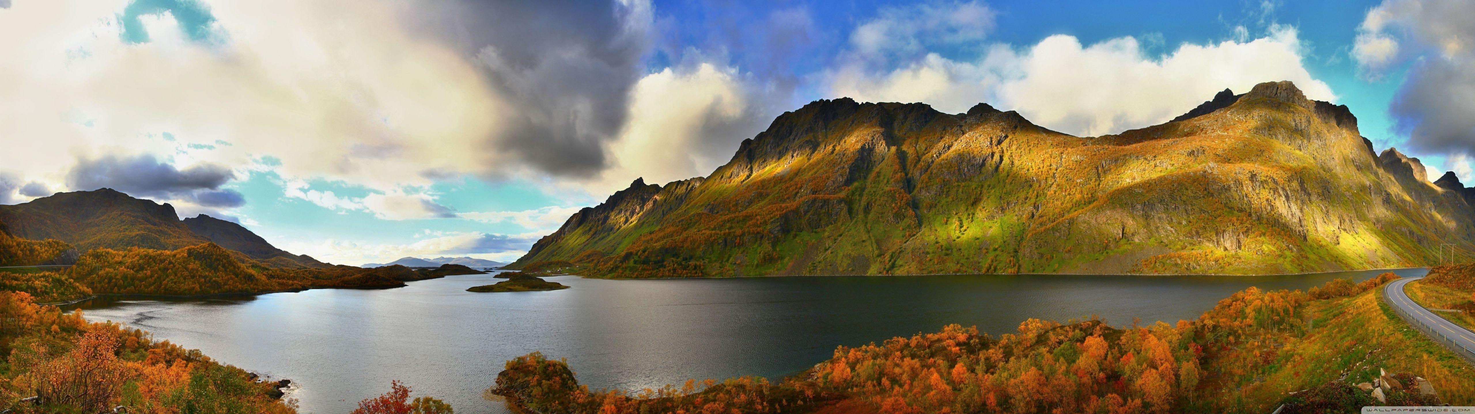 Wallpaper #uHMFhY4BFI5NbQks5R2B41 A Tranquil Autumn Mountain Lake Surrounded by Colorful Trees and Rocky Peaks