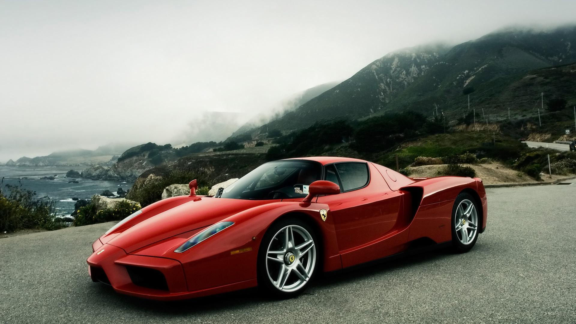 Wallpaper #6HOoiI4BFI5NbQksoSFu38 A Red Ferrari Enzo Parked on a Cliff Overlooking the Ocean