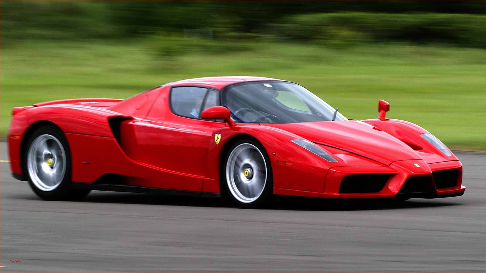 Wallpaper #JEUIr44B7YBJg1BVAaom14 A Red Ferrari Enzo Races Around a Track
