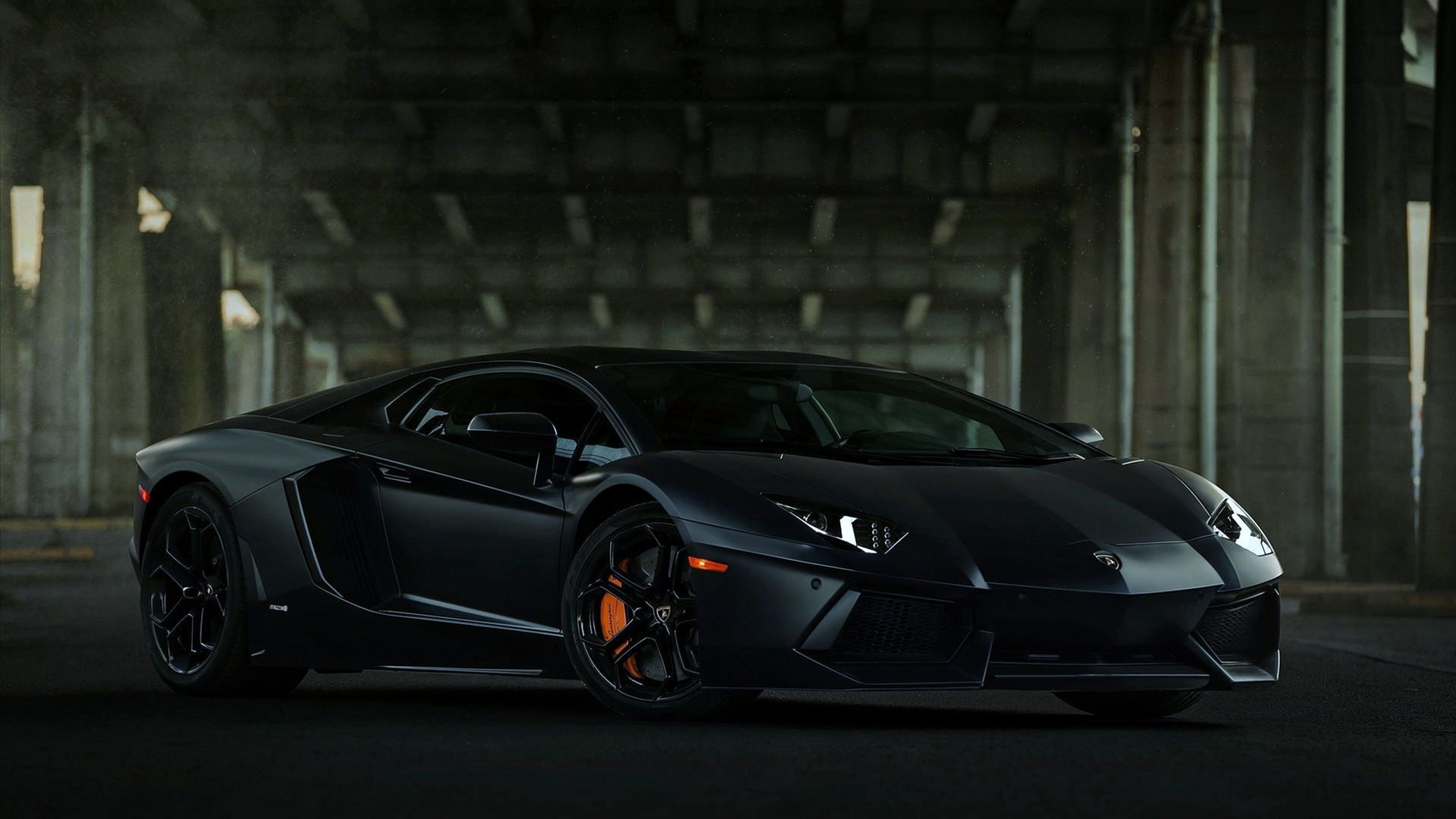 Wallpaper #-nP_iI4BFI5NbQks_iGJ40 A Matte Black Lamborghini Aventador Parked in a Dark Tunnel