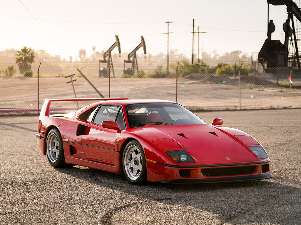 Wallpaper #K3OBh44BFI5NbQksaSEI11 A Sleek Red Ferrari F40 Parked in a Desert Setting