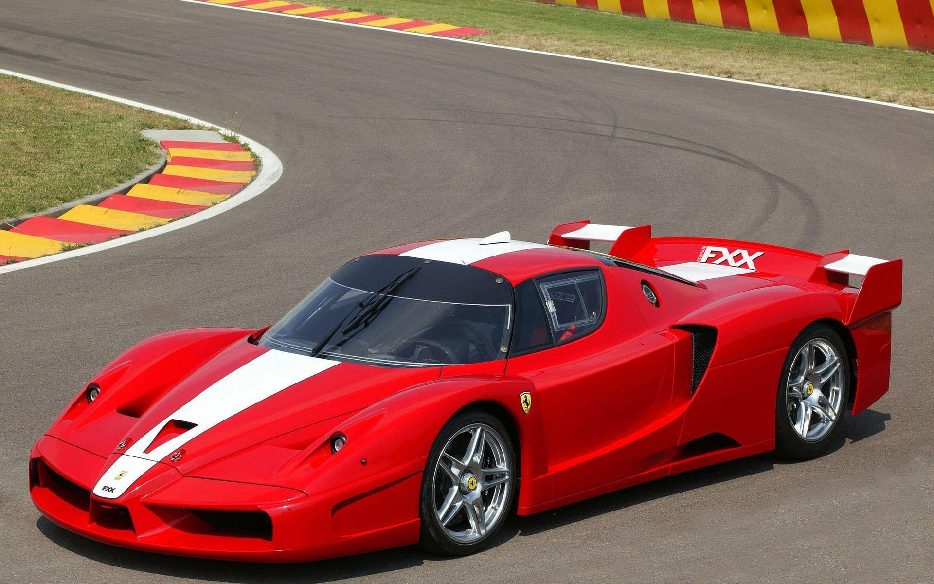 Wallpaper #JEUIr44B7YBJg1BVAaom53 A Red Ferrari Enzo on a Racetrack
