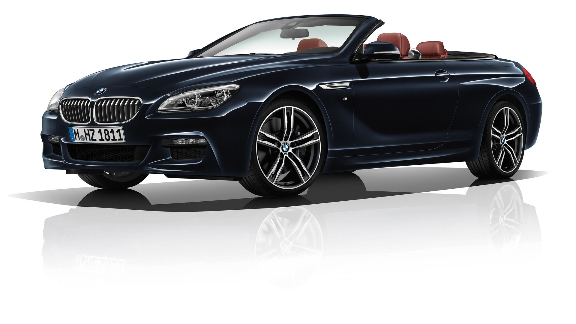Wallpaper #VkVolo4B7YBJg1BVLqAC8 A Sleek Black BMW 6 Series Convertible with the Top Down