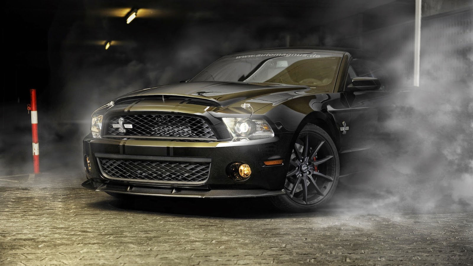 Wallpaper #nUUgl44B7YBJg1BVN6AP17 A Black Ford Mustang Shelby Gt500 in a Smoky Burnout