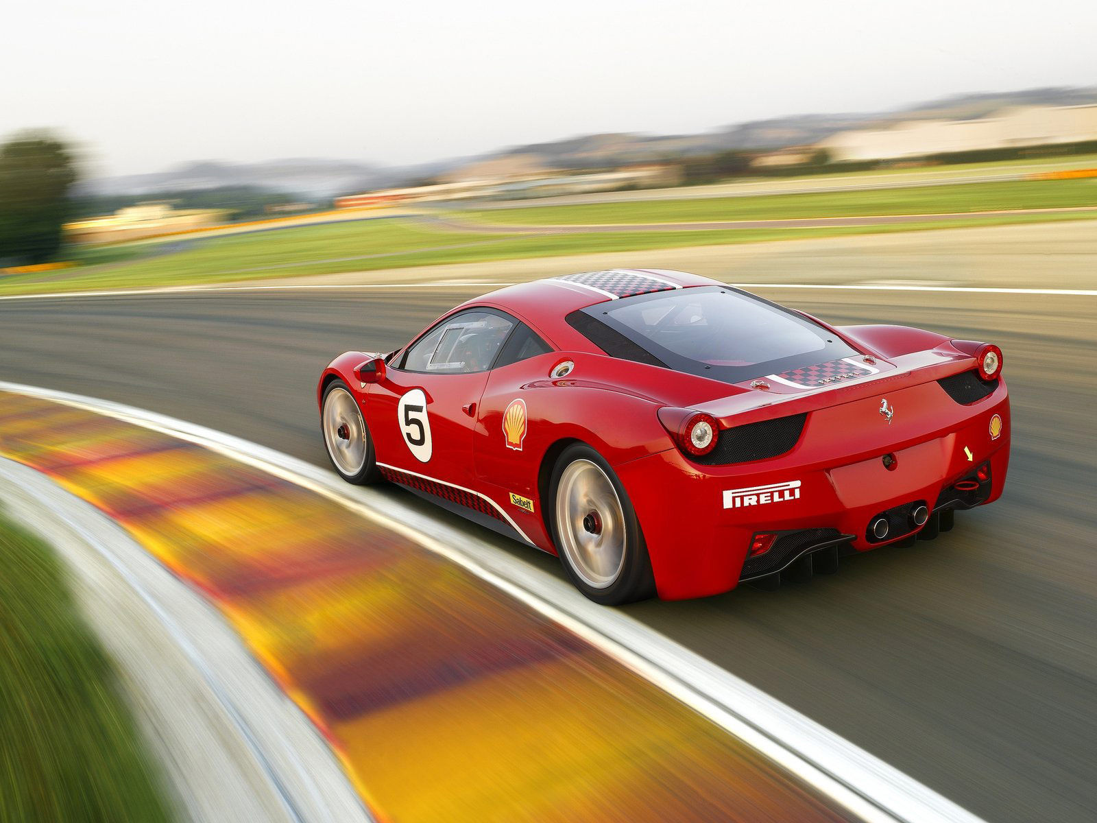 Wallpaper #53NJh44BFI5NbQkspCDD12 A Sleek Red Ferrari 458 Italia Racing Around a Track