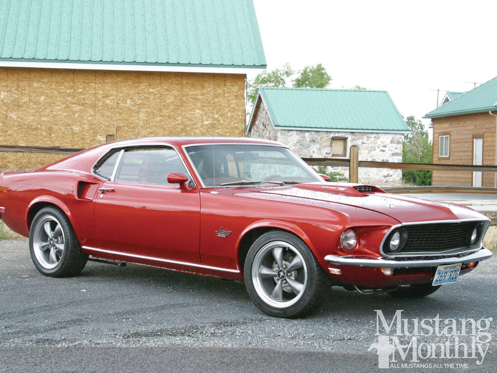 Wallpaper #GUUPmI4B7YBJg1BV-qHR54 A Red 1969 Ford Mustang Mach 1 Parked in Front of a Barn