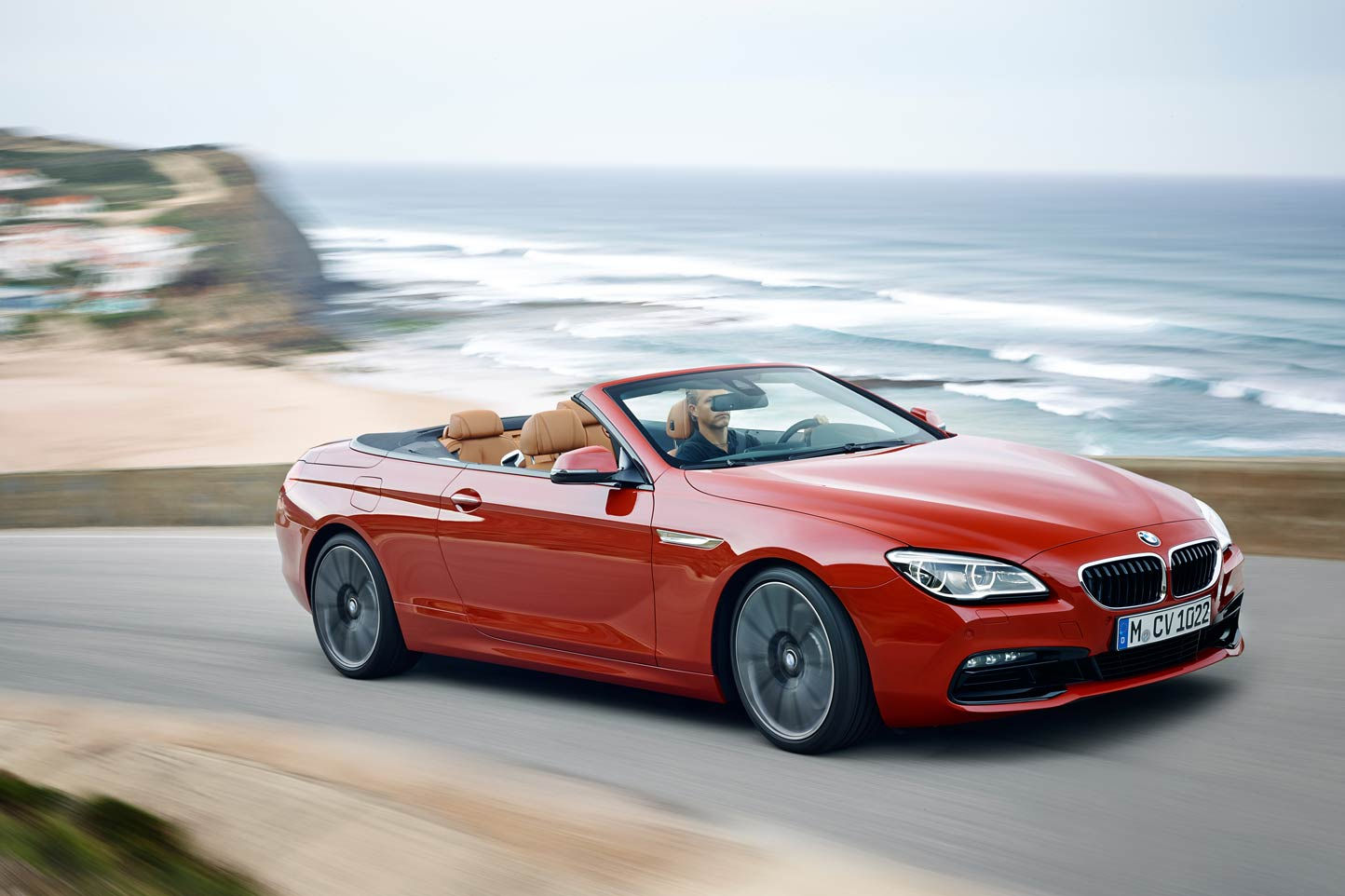 Wallpaper #VkVolo4B7YBJg1BVLqAC11 A Red BMW 6 Series Convertible Driving on a Coastal Road