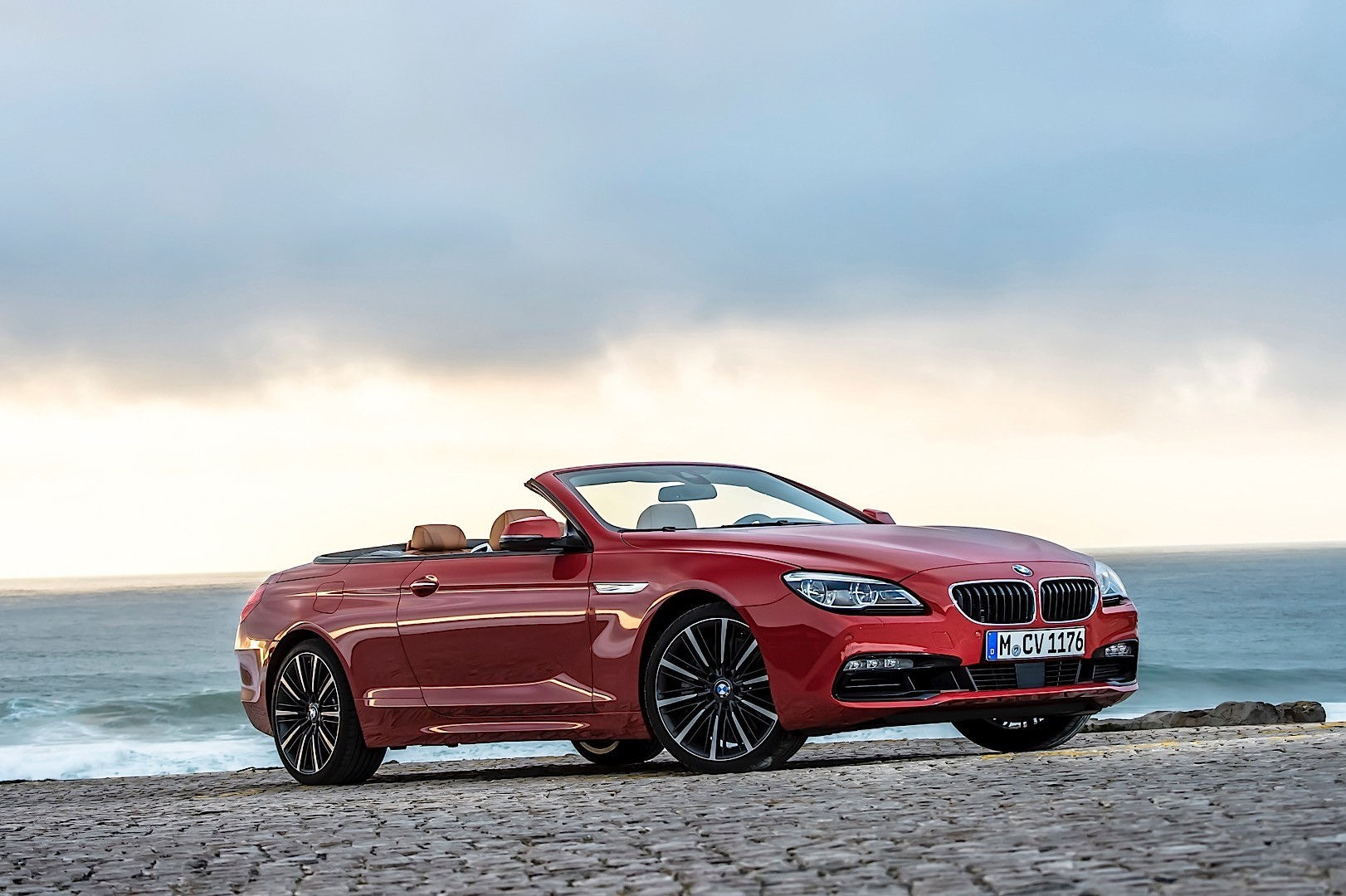 Wallpaper #VkVolo4B7YBJg1BVLqAC18 A Red BMW 6 Series Convertible Parked on a Coastal Road with the Ocean in the Background