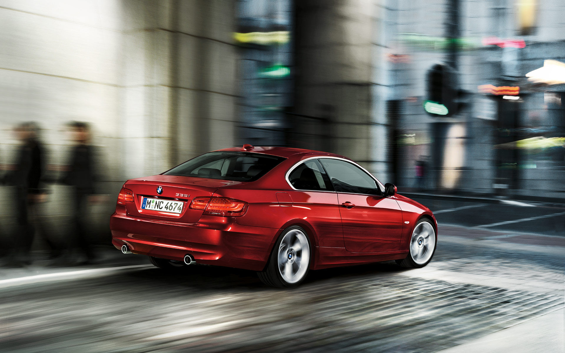 Wallpaper #lUW_oo4B7YBJg1BVBqSA57 A Red BMW Drives Through a Busy City Street