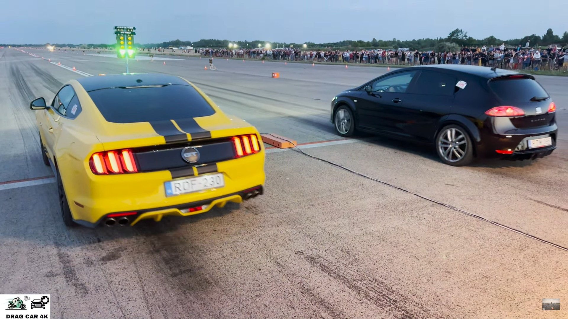 Wallpaper #HGfr9pIBSpphPi3-GYUW267 Ford Mustang GT Drags Modified Seat Leon on Unprepped Tarmac Still