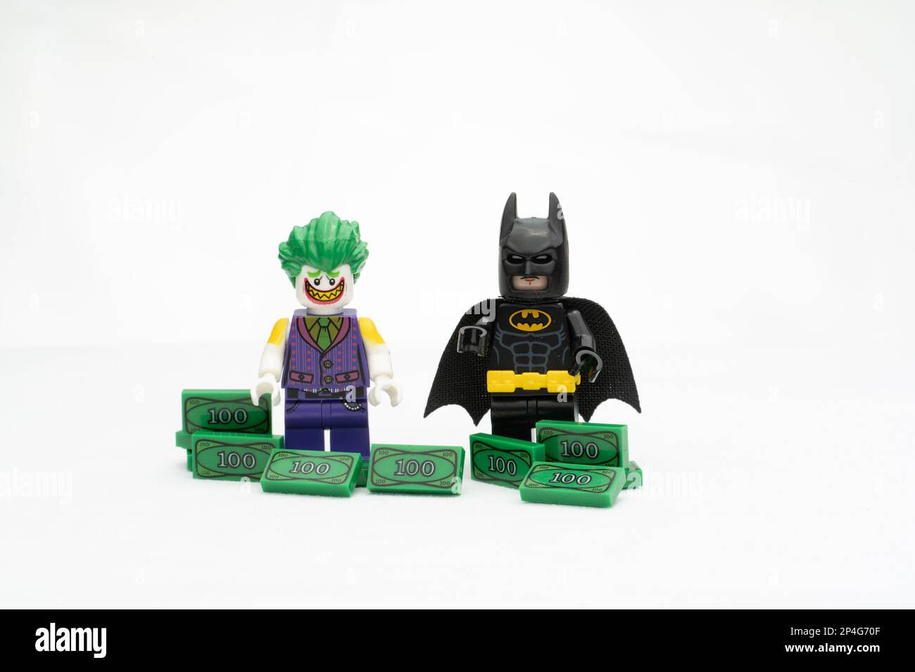 Wallpaper #ymcACZMBSpphPi3-8M2J429 Two Lego Characters Featuring Batman and Joker Standing on Dollar Bills