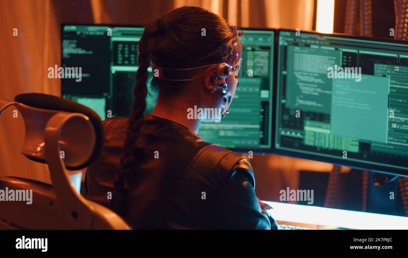 Wallpaper #I6WROJMBVBiSkHCaw440221 Back View of a Cyberpunk Girl Types on the Keyboard Multiple Computer
