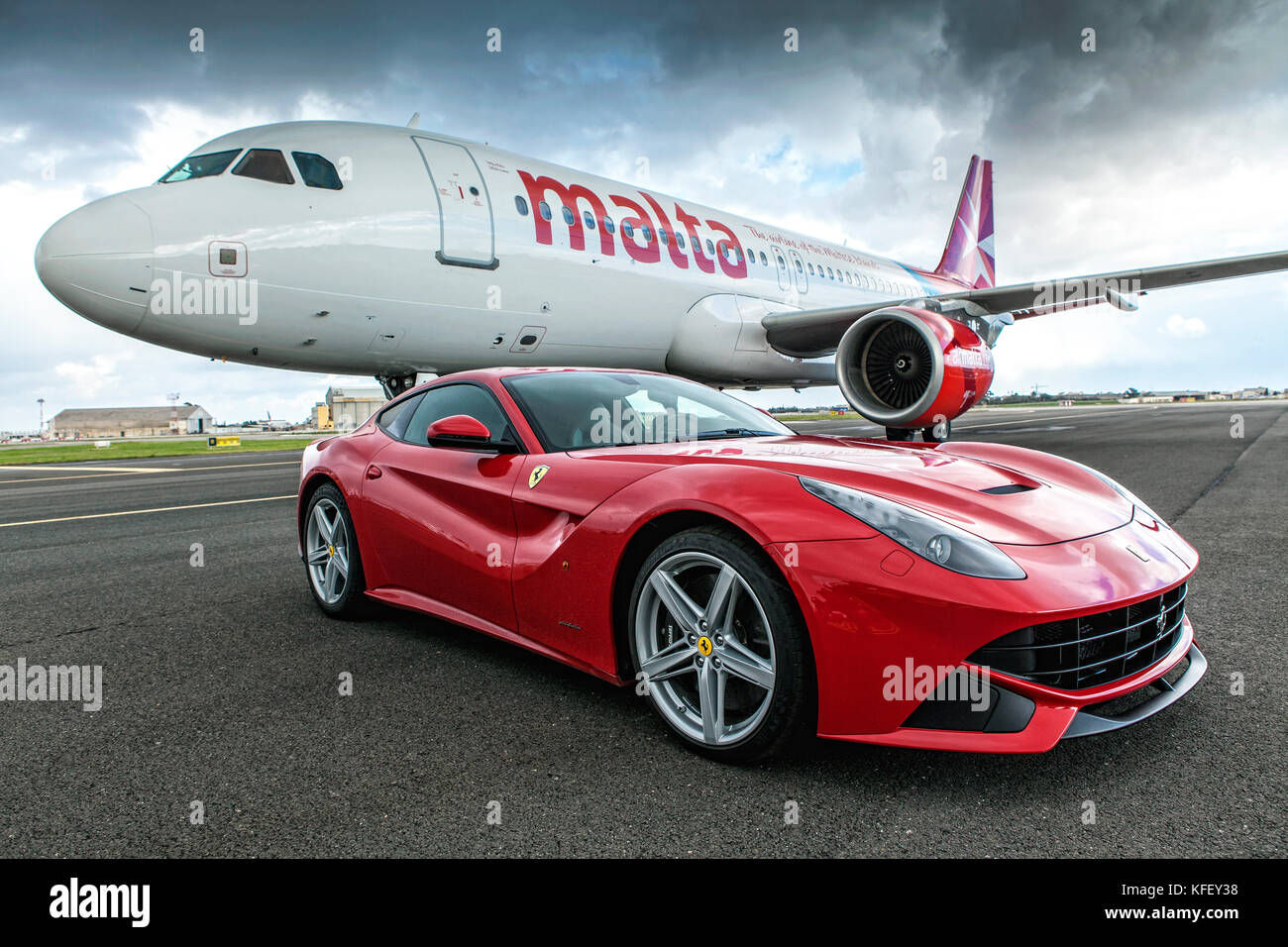 Wallpaper #lmiaHZMBSpphPi3-Uyac31 Luqa Malta Dec 09 Ferrari F12 Supercar Next to an Airmalta Airbus