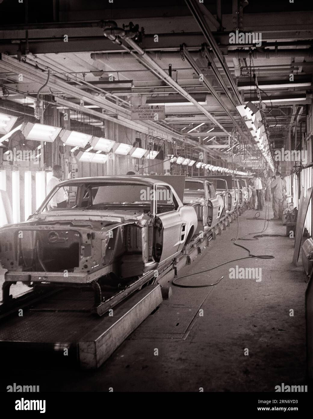 Wallpaper #-ELQPJMBOBpx0NhmL8EM276 1960s Ford Mustang Automobile Car Bodies on Assembly Line Edison