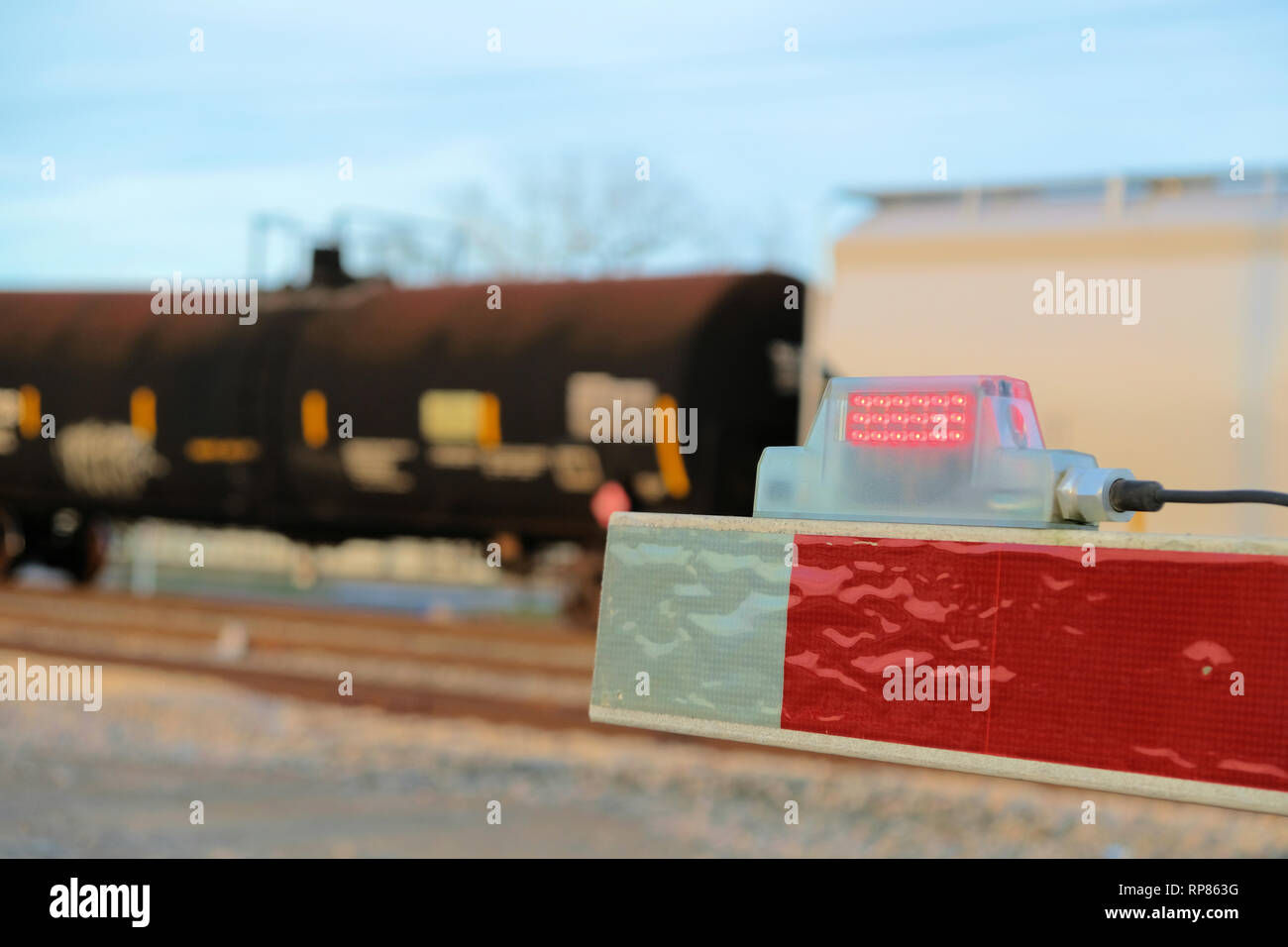 Wallpaper #TGdYAZMBSpphPi3-s6qB295 Close Up of the End Tip of a Railway Boom Barrier at a Level Railway