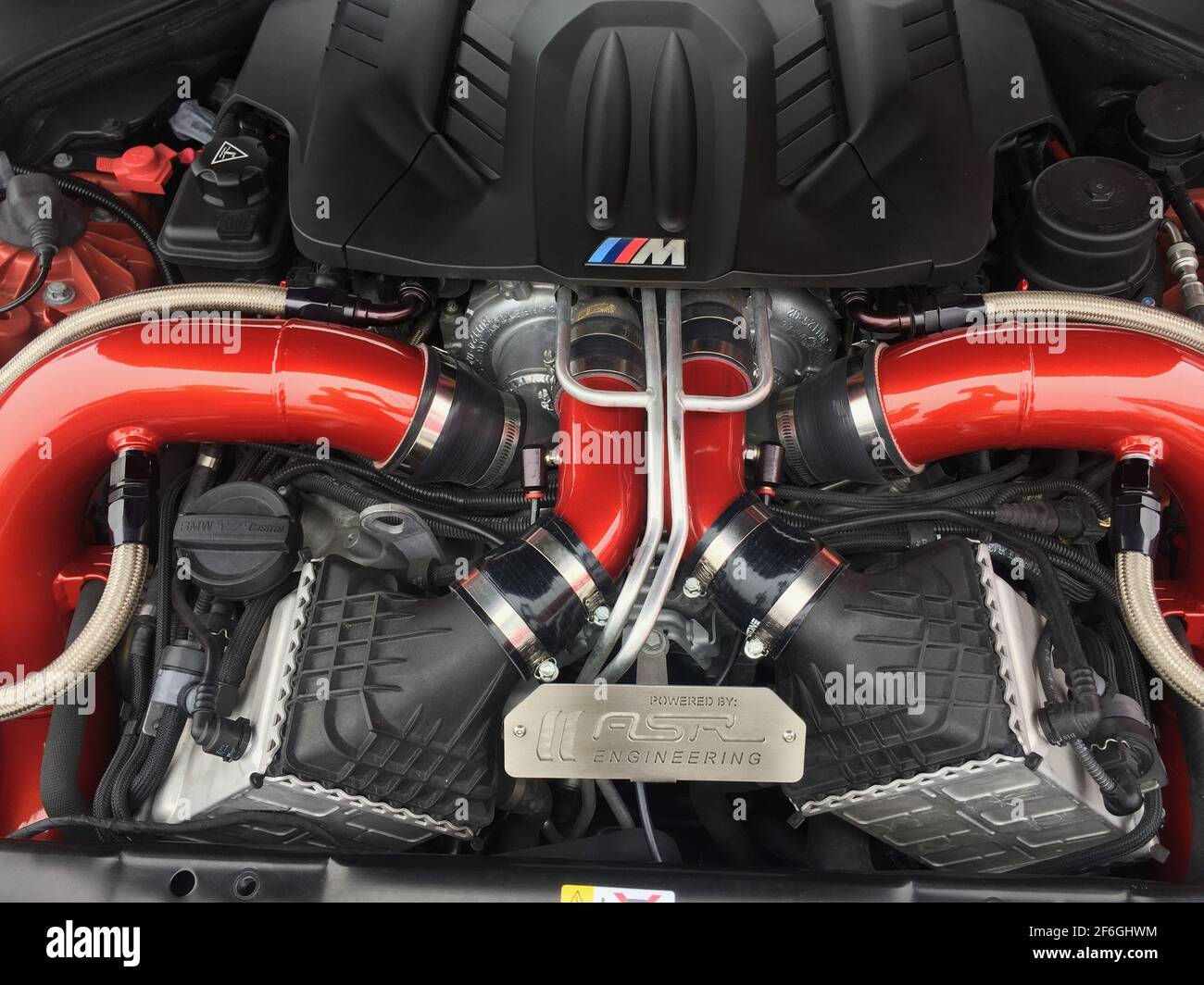 Wallpaper #nHM3gY4BFI5NbQkscRi436 A Close-Up of a Car Engine with Red and Black Components