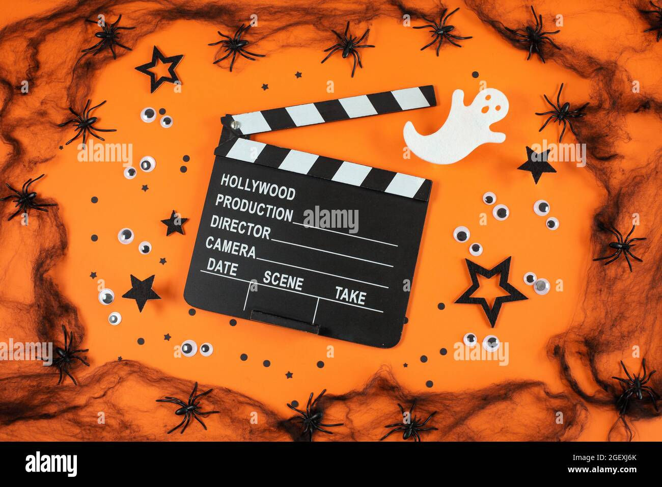 Wallpaper #RfS4OZMBKFX8bn3rZXfT87 Clapper Board in Spider Webs Spiders Ghost Eyes on Orange Background