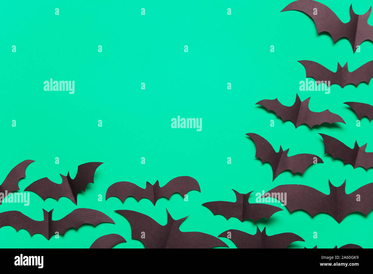 Wallpaper #r3KDMpMBX2lk1u3ogFrF234 Halloween Paper Vampire Bat Decorations on a Green Background Stock