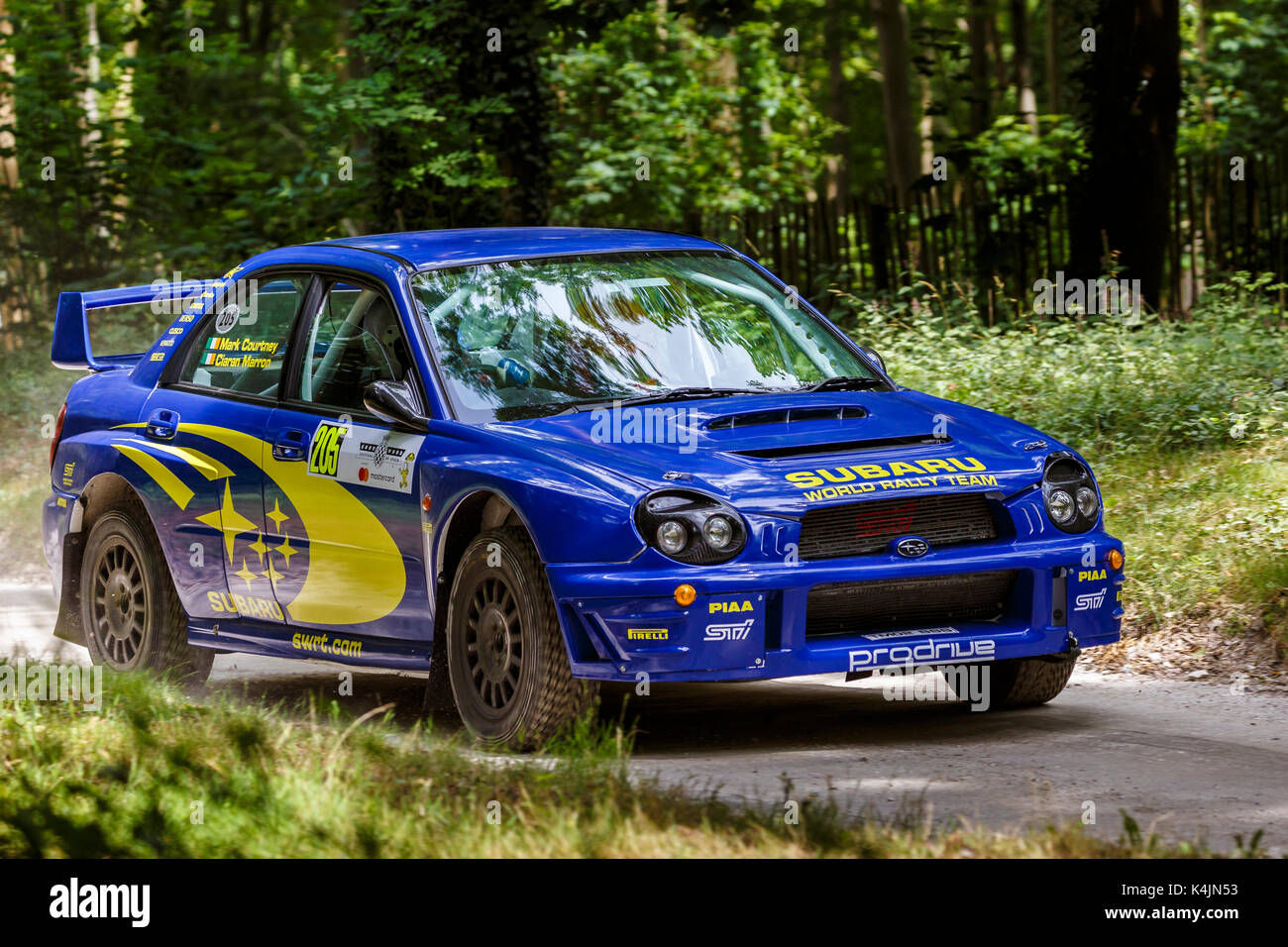 Wallpaper #MZ-zWJMBcUVgGJNo7rEQ205 2002 Subaru Impreza S8 Wrc on the Forest Rally Stage with Driver Mark