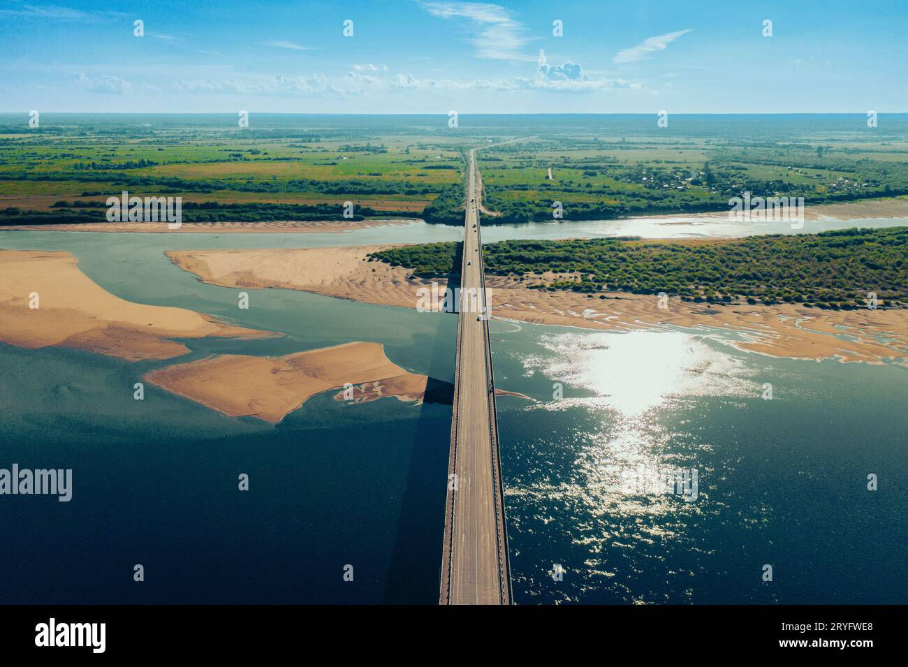 Wallpaper #phoQUpMB1yWOL4qgsYK1269 Aerial Drone Shot of Cars Driving on Bridge Over River and Sandy