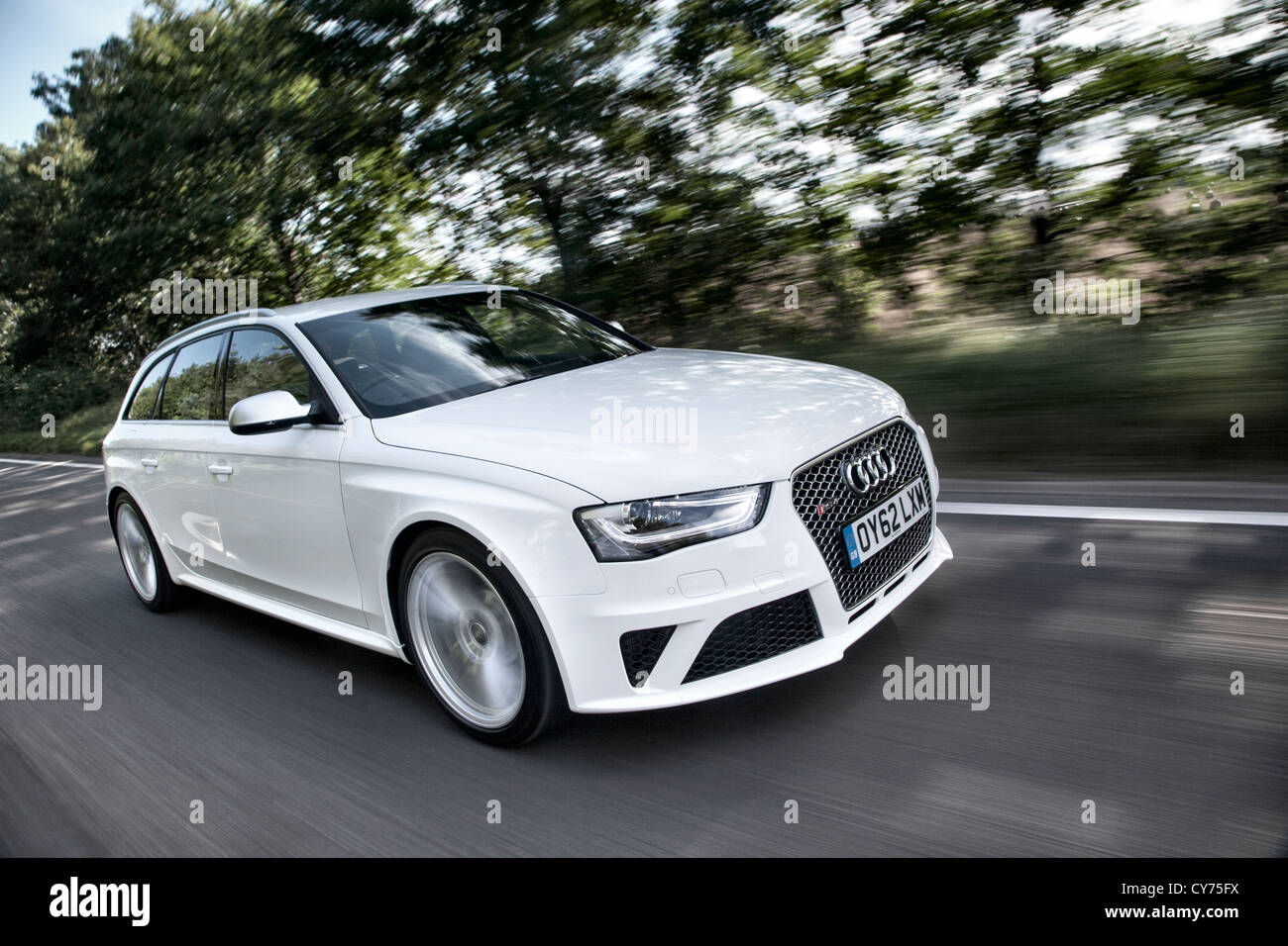 Wallpaper #I2eo75IBSpphPi3-JmPe29 Audi Rs4 Avant Driving at Speed on an English Country Road Stock Photo