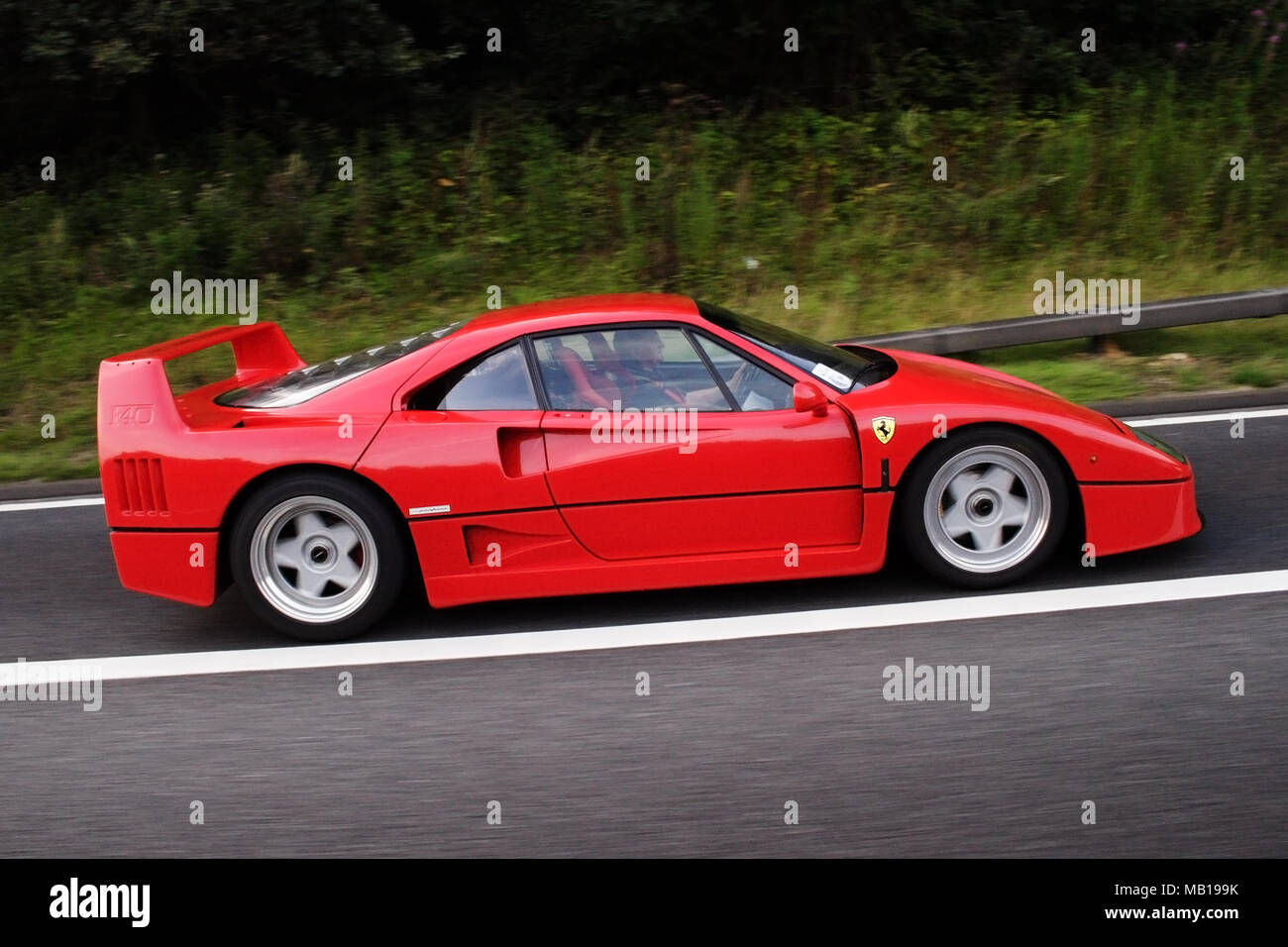 Wallpaper #mWd19JIBSpphPi3-AXqd39 Red Modern Classic Ferrari F40 in Profile Side View Driving on the
