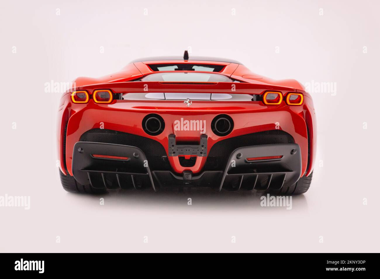 Wallpaper #Ihq5UZMB1yWOL4qgL4I_161 The Rear End of a Red Ferrari Sf90 Stradale in a Studio on White