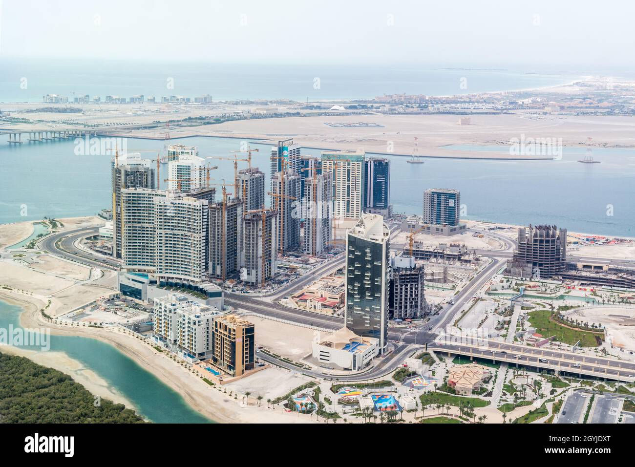 Wallpaper #TGeJ8ZIBSpphPi3-k2wF281 Aerial Drone Shot of Al Reem Island Buildings Gate Towers Sun and