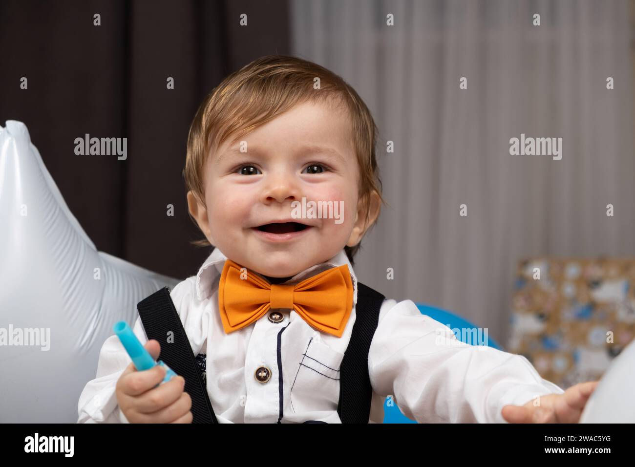 Wallpaper #H0CLMZMBJhL2WPba8Me7391 Portrait of a One Year Old Red Haired Boy Wearing a Shirt with a Bow