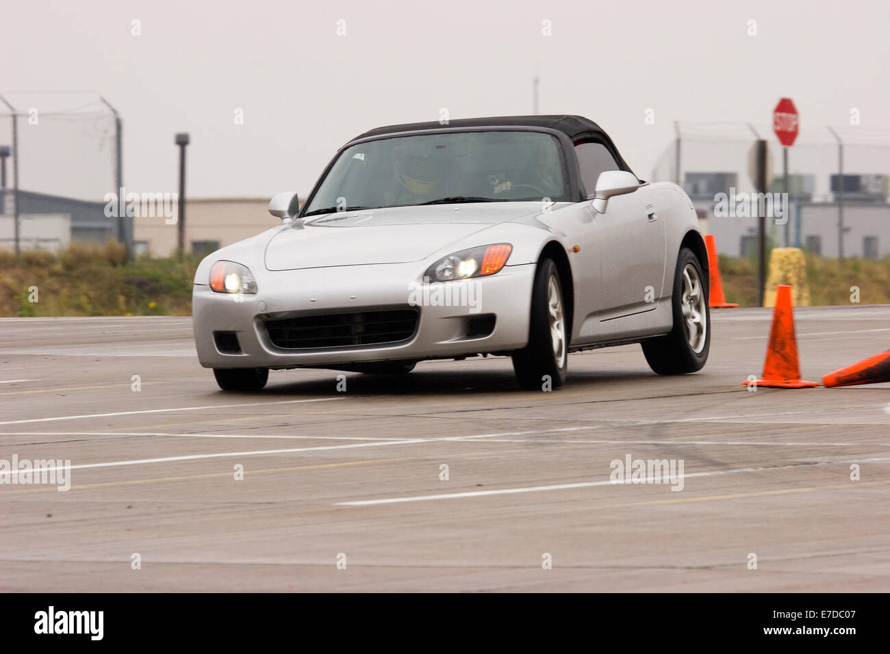 Wallpaper #VPCpfZcBi4JM6agGjh8B94 A Gray Convertible Honda S2000 Sports Car in an Autocross Race at a