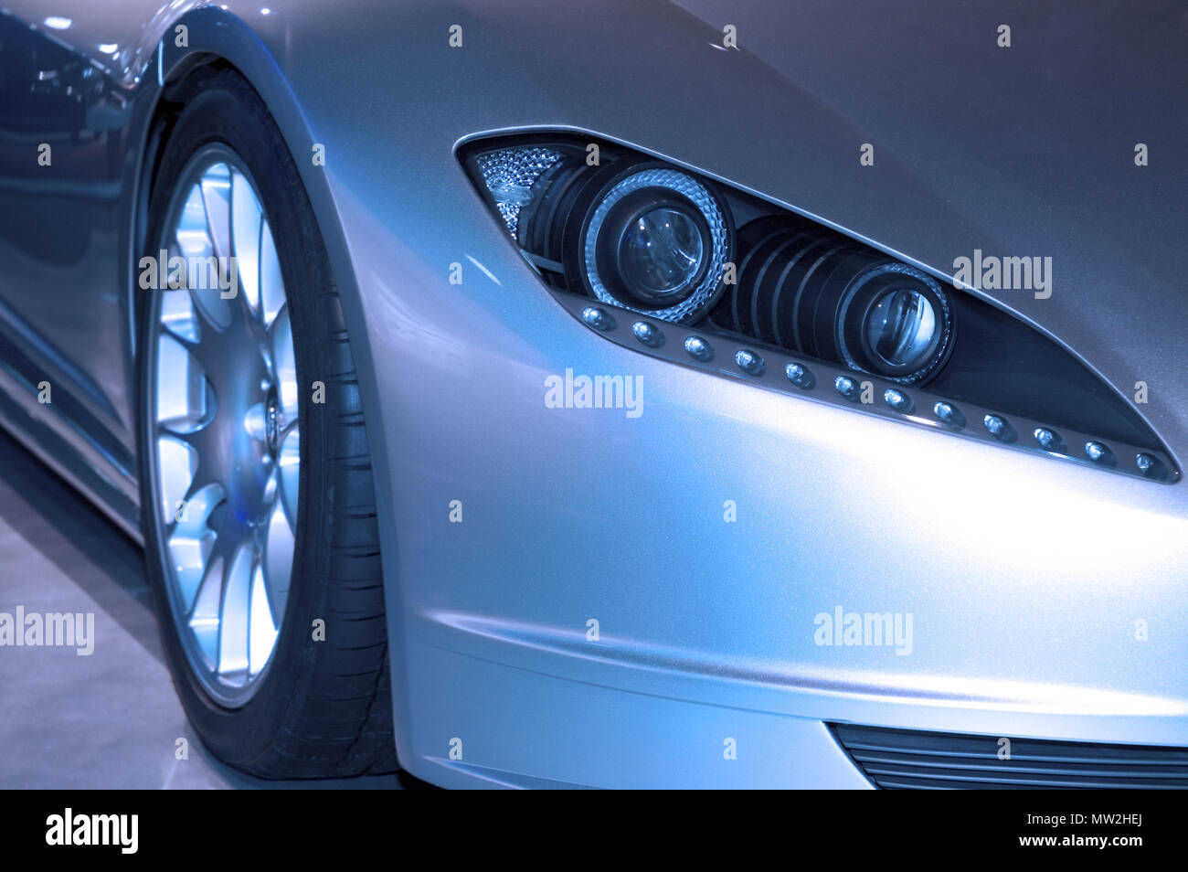 Wallpaper #AhnJDo8BtGB6xQ782Vvu36 Modern Looking Front Headlight Assembly of a New 2006 Sports Luxury Car
