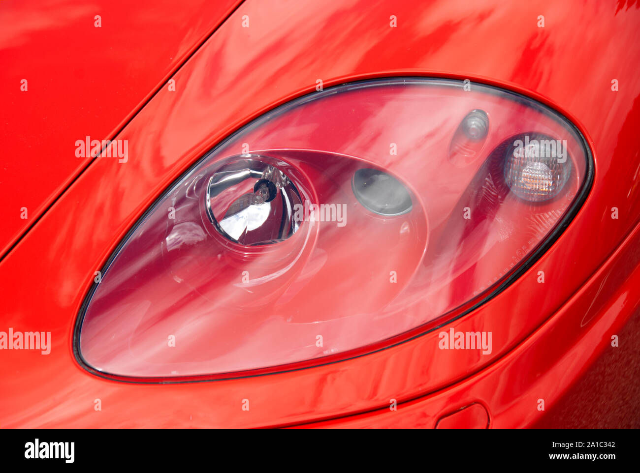 Wallpaper #nBn9EI8BtGB6xQ78qWAP40 Close Shot of Headlamp Configuration on Red Ferrari Sports Car Stock