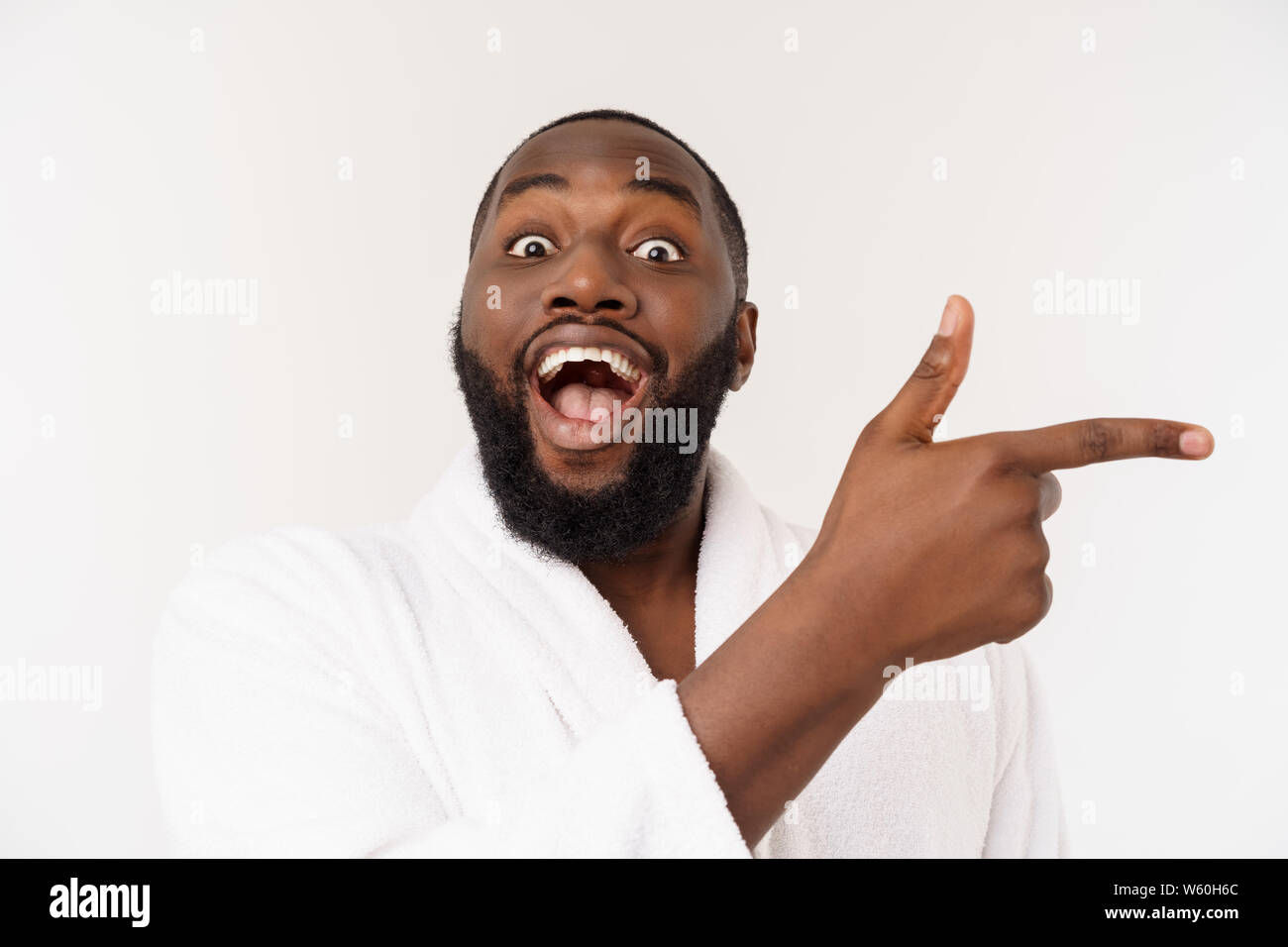 Wallpaper #IWf6_JIBSpphPi3-lZoB112 Black Guy Wearing a Bathrobe Pointing Finger with Surprise and Happy