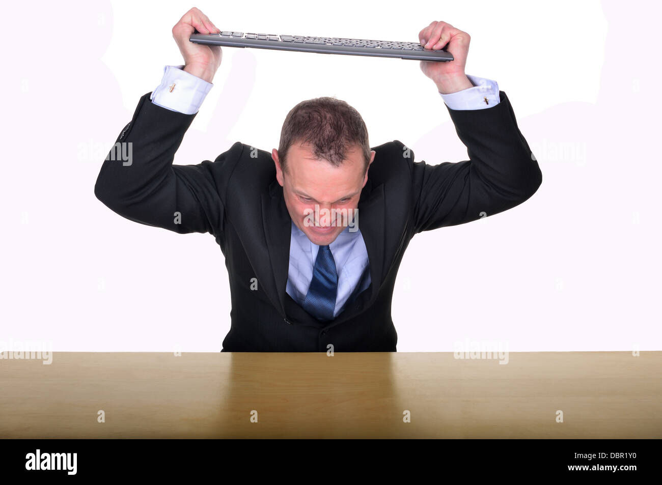 Wallpaper #p2fJ6JIBSpphPi3-wz7s84 Image of a Businessman at a Desk About to Smash a Keyboard in