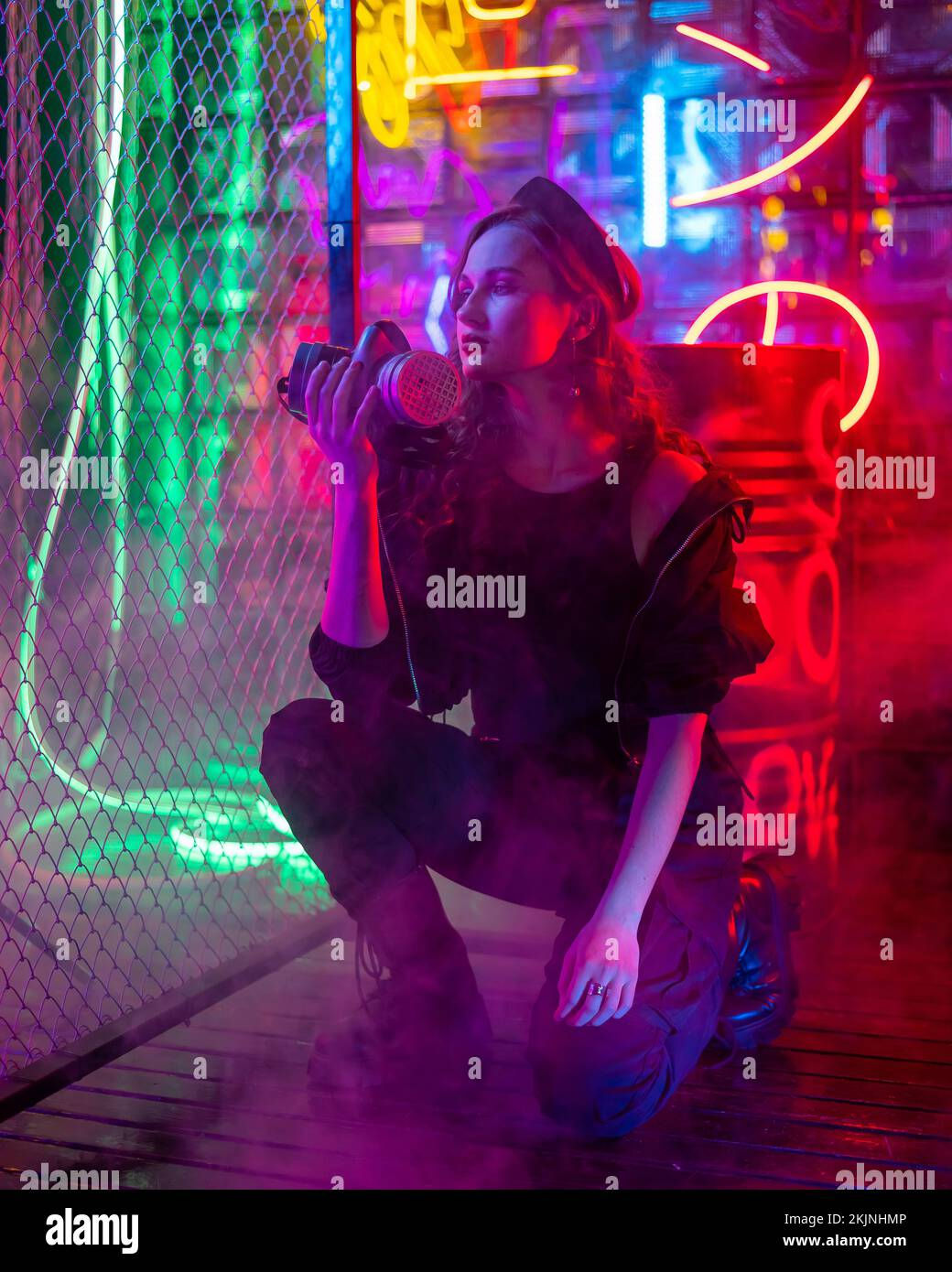 Wallpaper #LW0KapcBycdYOYFTMnFY55 Caucasian Woman with a Gas Mask in Her Hands in a Neon Studio Stock
