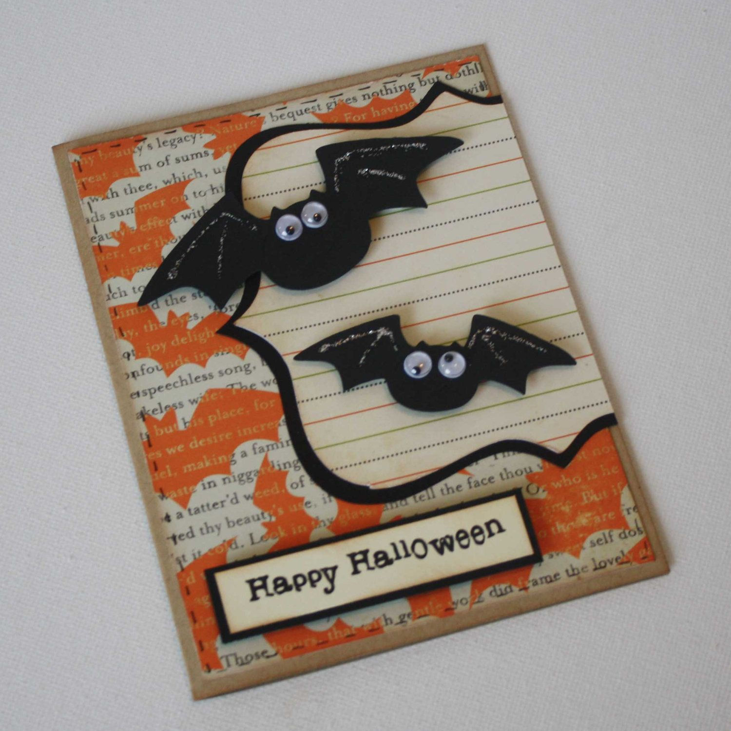 Wallpaper #ITHVNZMB5zzyi_yYzVif25 A Halloween Card with Two Bats on It