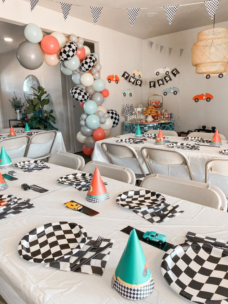 Wallpaper #i7gD25IBJvJKYCmEgfRe215 A Party with Balloons Checkered Table Cloths and Paper Hats on the Tables