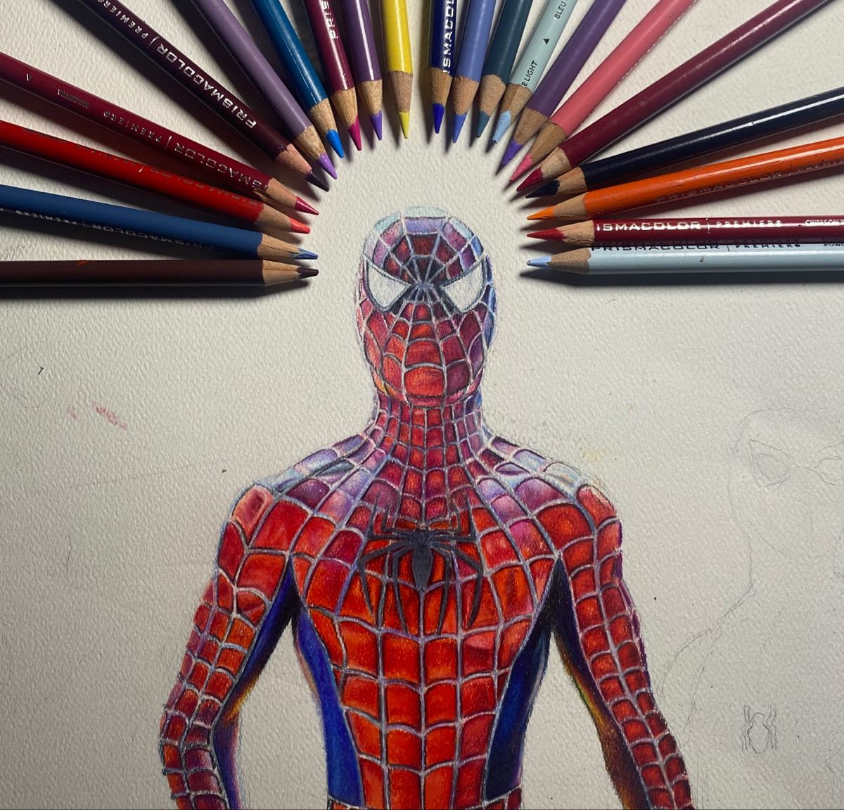 Wallpaper #2DG6NZMB5zzyi_yYf1cF222 A Drawing of a Spider Man with Colored Pencils in His Face and Arms